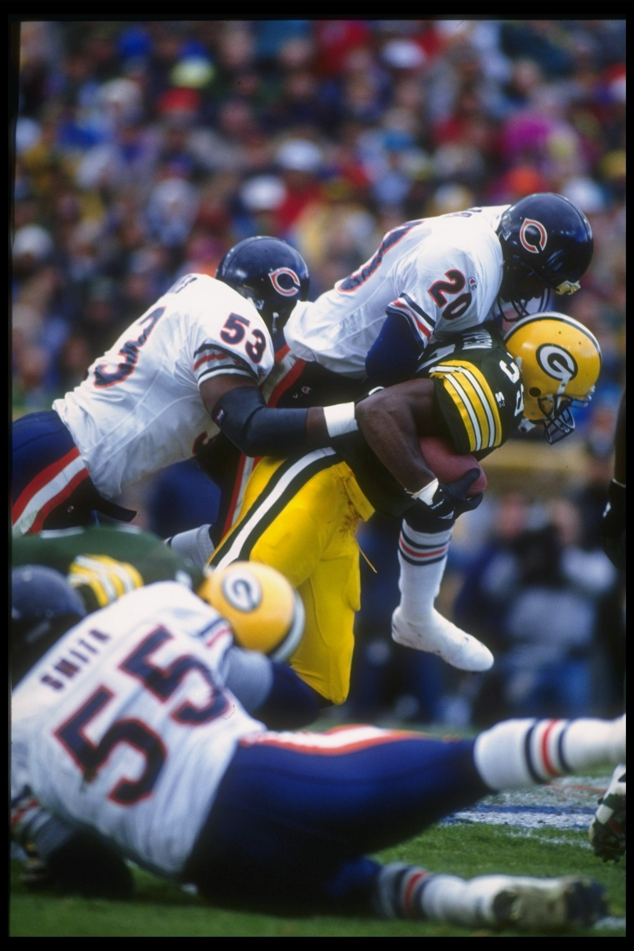 31 Oct 1993:  Running back Darrell Thompson of the Green Bay Packers is tackled by defensive back Mark Carrier of the Chicago Bears during a game at Soldier Field in Chicago, Illinois.  The Packers won the game, 17-3. Mandatory Credit: Jonathan Daniel  /A