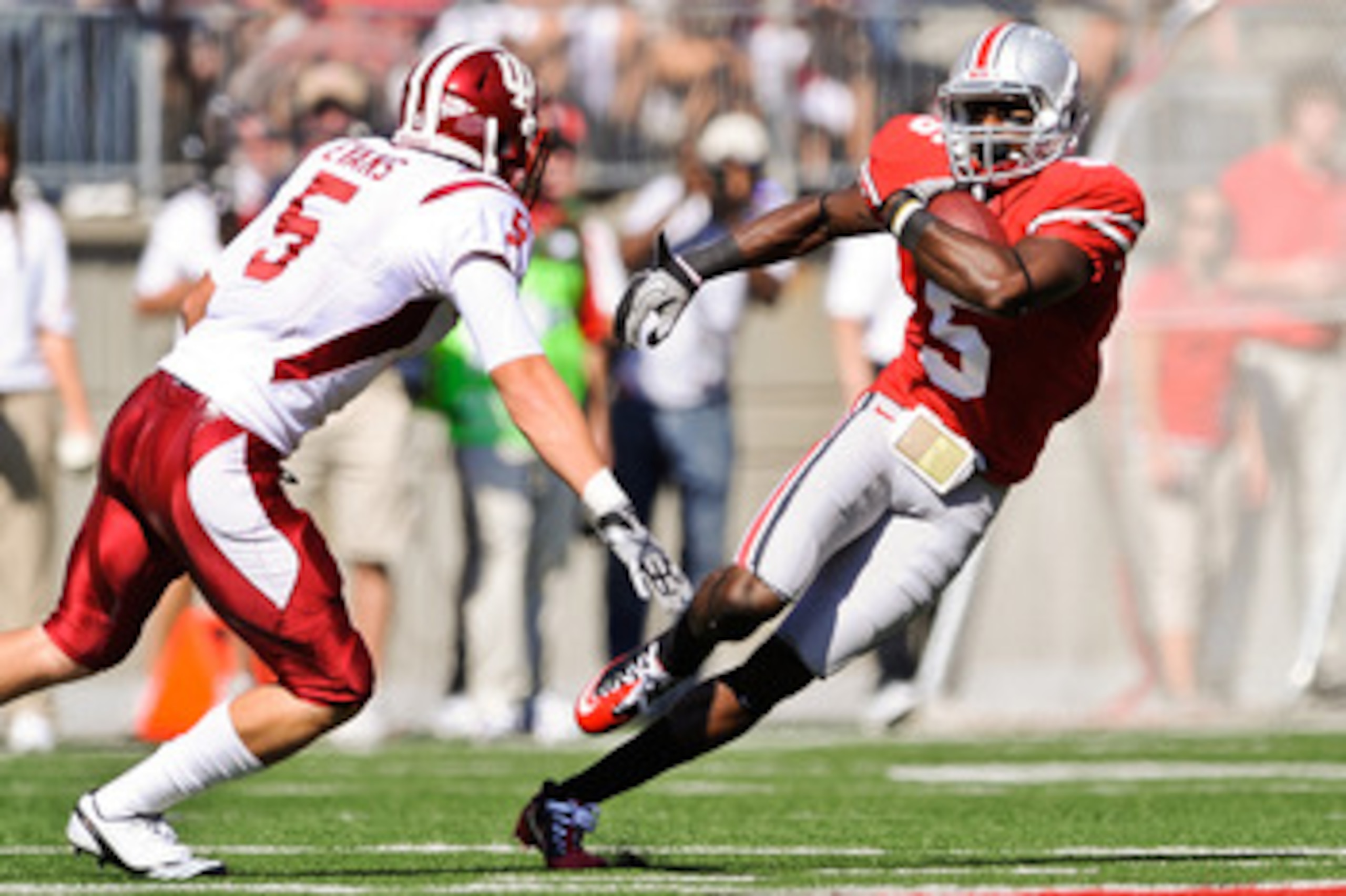 COLUMBUS, OH - OCTOBER 9:  Taurian Washington #5 of the Ohio State Buckeyes runs with the ball against the Indiana Hoosiers at Ohio Stadium on October 9, 2010 in Columbus, Ohio.  (Photo by Jamie Sabau/Getty Images)