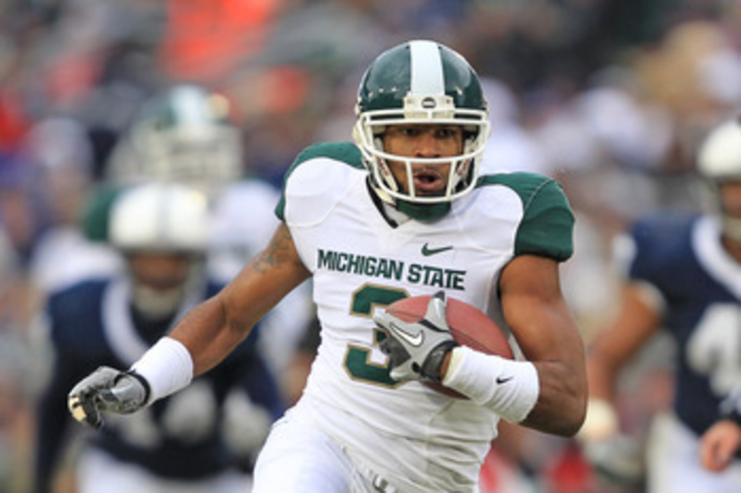 STATE COLLEGE, PA - NOVEMBER 27: Wide receiver B.J. Cunningham #3 of the Michigan State Spartans runs with the ball during a game against the Penn State Nittany Lions on November 27, 2010 at Beaver Stadium in State College, Pennsylvania. The Spartans won