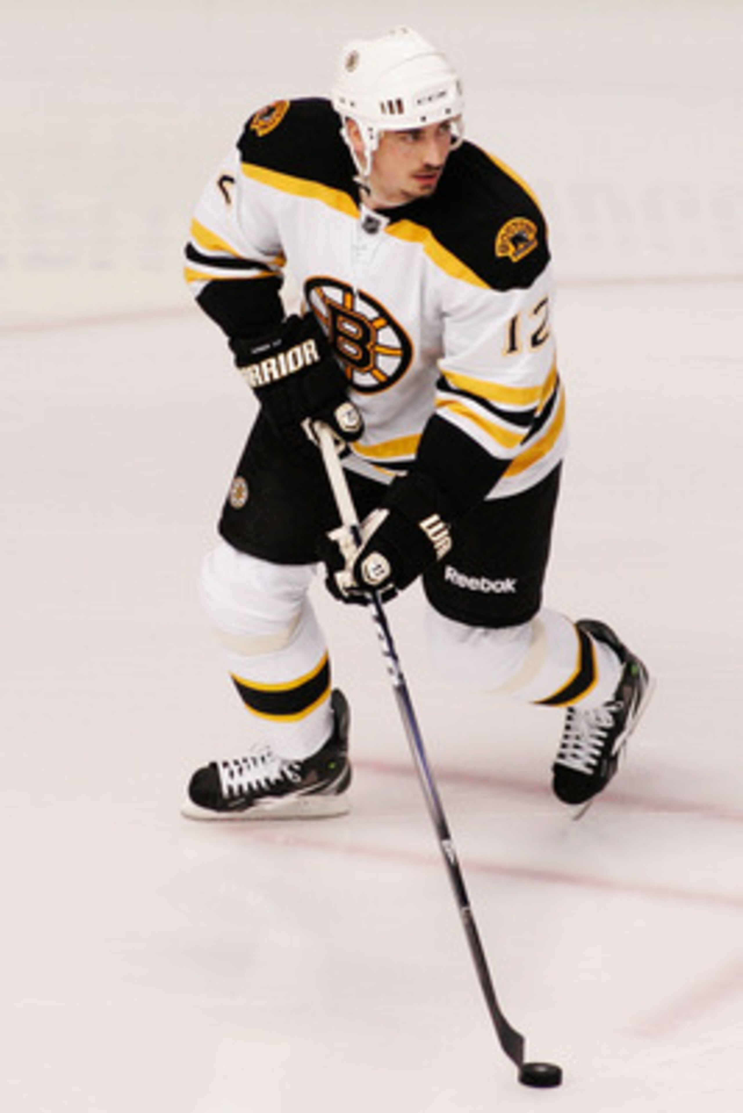 TAMPA, FL - MAY 19:  Tomas Kaberle #12 of the Boston Bruins controls the puck in Game Three of the Eastern Conference Finals against the Tampa Bay Lightning during the 2011 NHL Stanley Cup Playoffs at St Pete Times Forum on May 19, 2011 in Tampa, Florida.