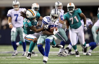ARLINGTON, TX - SEPTEMBER 02:  Wide receiver Kevin Ogletree #85 of the Dallas Cowboys runs past Nolan Carroll #28 of the Miami Dolphins during a preseason game at Cowboys Stadium on September 2, 2010 in Arlington, Texas.  (Photo by Ronald Martinez/Getty I