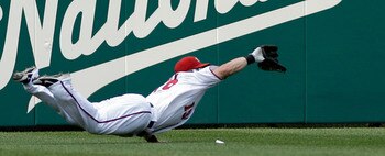 WASHINGTON, DC - JUNE 01: Left fielder Laynce Nix #19 of the Washington Nationals catches a ball hit by  Domonic Brown #9 of the Philadelphia Phillies (not pictured) for the third out of the sixth inning at Nationals Park on June 1, 2011 in Washington, DC
