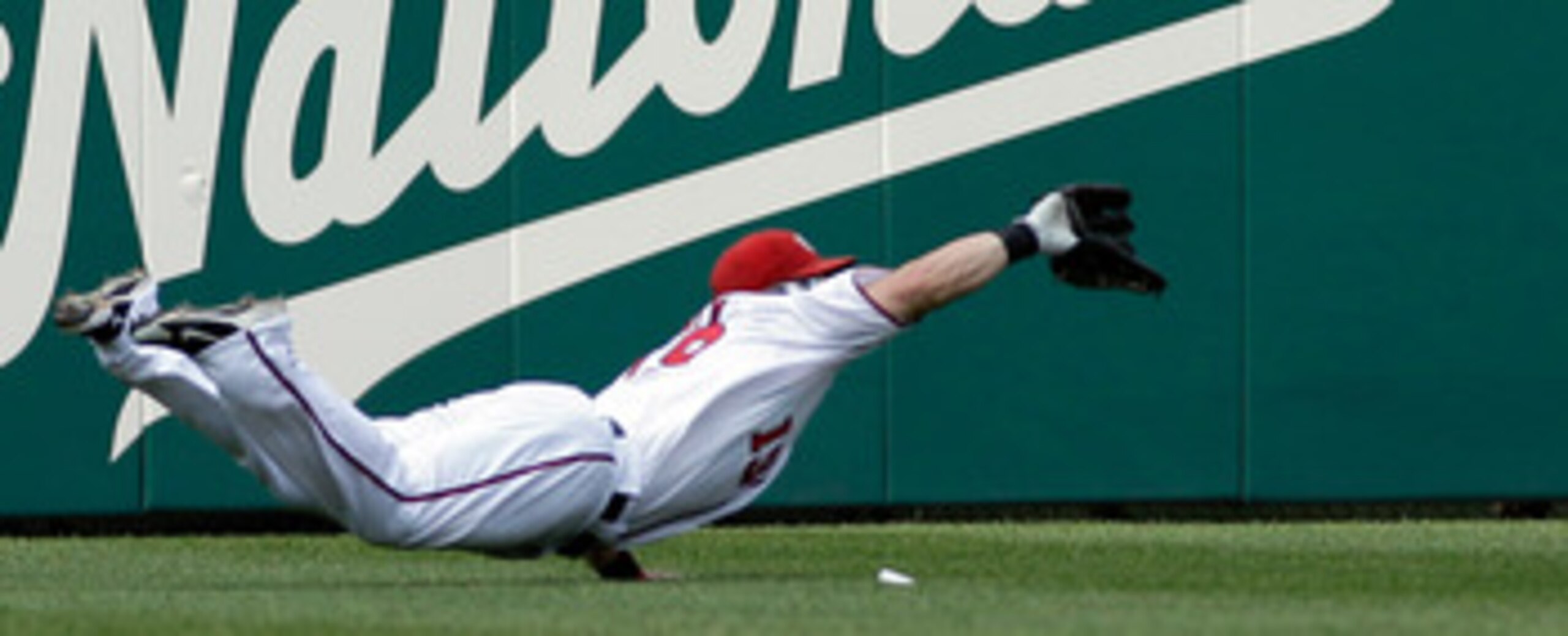 WASHINGTON, DC - JUNE 01: Left fielder Laynce Nix #19 of the Washington Nationals catches a ball hit by  Domonic Brown #9 of the Philadelphia Phillies (not pictured) for the third out of the sixth inning at Nationals Park on June 1, 2011 in Washington, DC