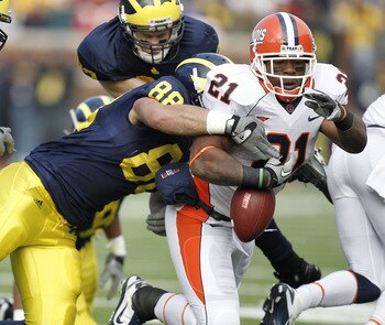 ANN ARBOR, MI - NOVEMBER 06:  Jason Ford #21 of the Illinois Fighting Illini fumbles while being tackled by Craig Roh #88 of the Michigan Wolverines at Michigan Stadium on November 6, 2010 in Ann Arbor, Michigan.  (Photo by Gregory Shamus/Getty Images)
