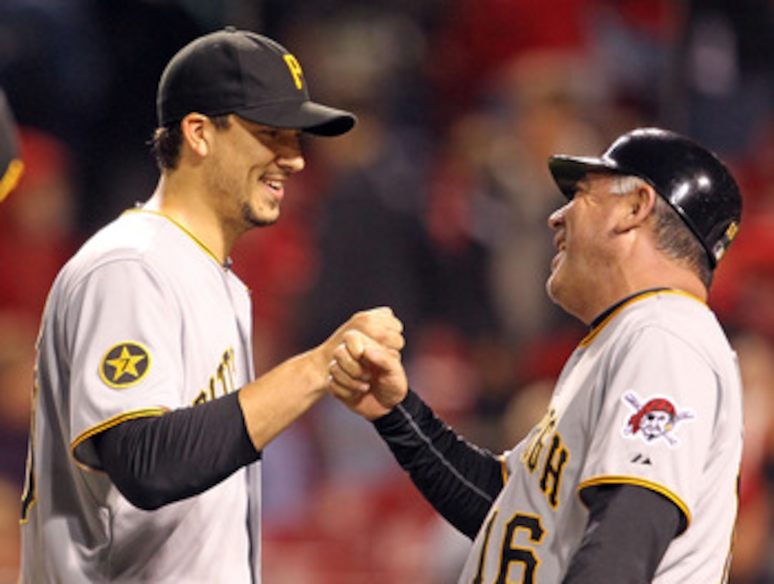 CINCINNATI, OH - MAY 18:  Charlie Morton #50 of the Pittsburgh Pirates is congratulated by Nick Leyva after pitching a 5 hit complete game shutout against the Cincinnati Reds at Great American Ball Park on May 18, 2011 in Cincinnati, Ohio.  The Pirates wo