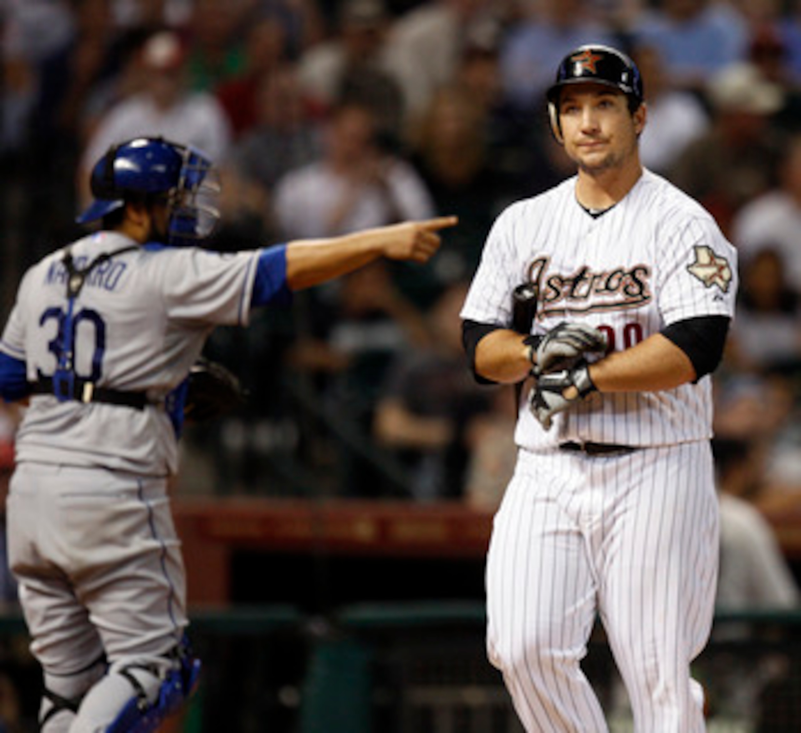 HOUSTON - MAY 24:  Brett Wallace #29 of the Houston Astros reacts after striking out as catcher Dioner Navarro #30 points to pitcher Rubby De La Rosa at Minute Maid Park on May 24, 2011 in Houston, Texas.  (Photo by Bob Levey/Getty Images)