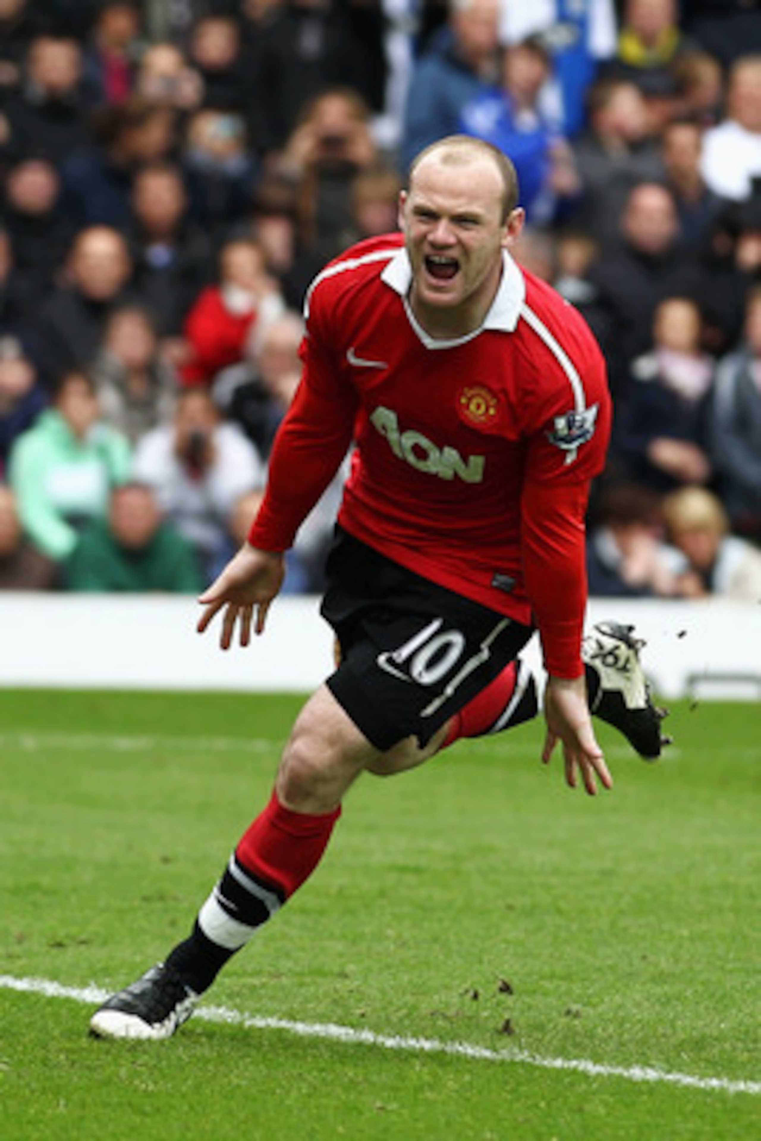 BLACKBURN, ENGLAND - MAY 14:  Wayne Rooney of Manchester United celebrates after scoring a penalty during the Barclays Premier League match between Blackburn Rovers and Manchester United at Ewood park on May 14, 2011 in Blackburn, England.  (Photo by Dean