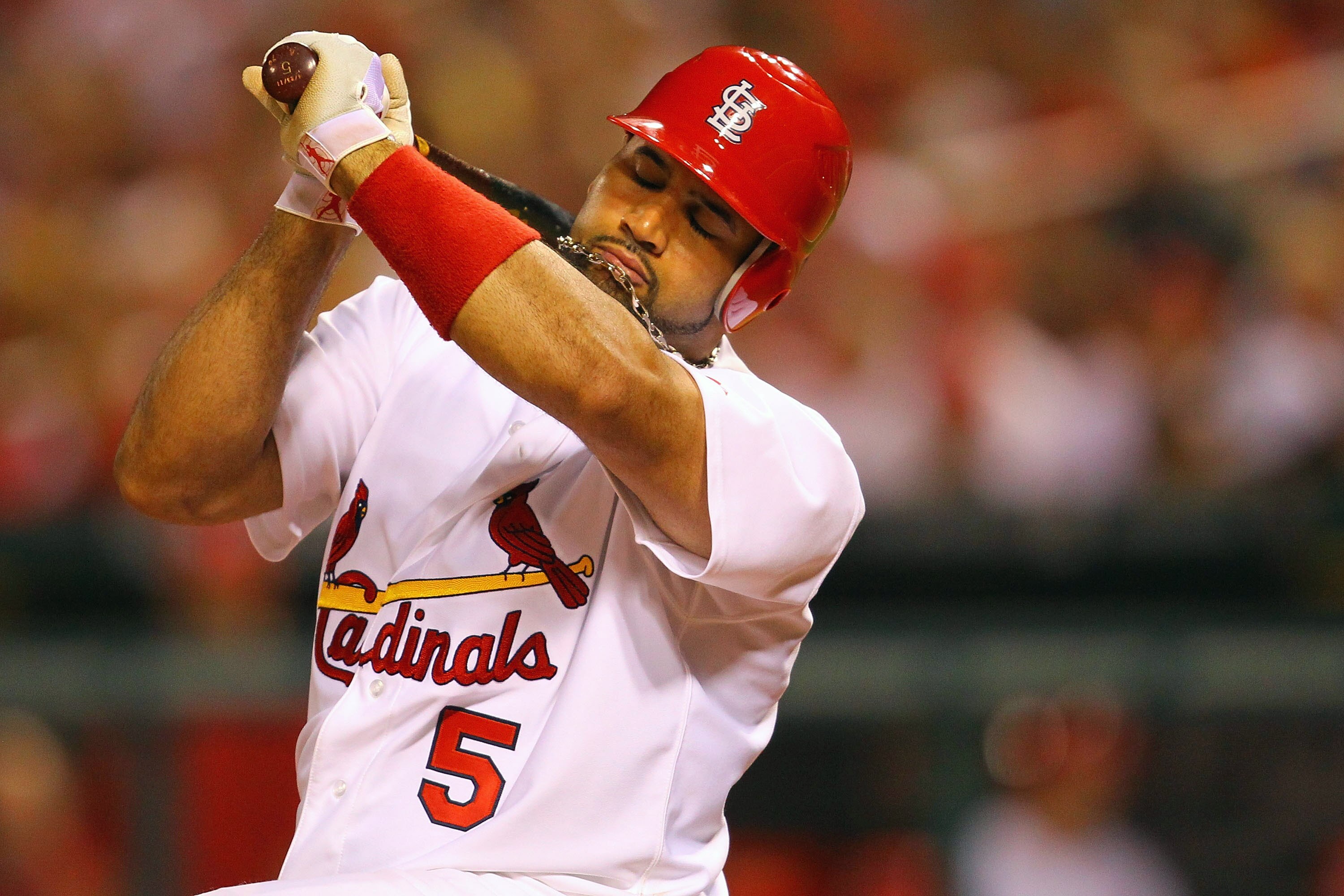 ST. LOUIS, MO - JUNE 1: Albert Pujols #5 of the St. Louis Cardinals dodges an inside pitch against the San Francisco Giants at Busch Stadium on June 1, 2011 in St. Louis, Missouri.  (Photo by Dilip Vishwanat/Getty Images)