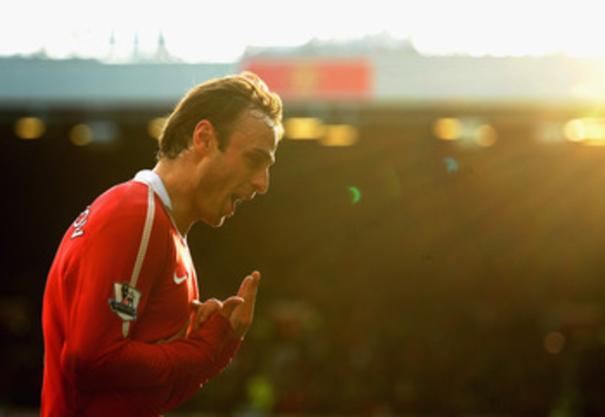 MANCHESTER, ENGLAND - MARCH 19: Dimatar Berbatov of Manchester United celebrates scoring the winning goal in the dying minutes during the Barclays Premier League match between Manchester United and Bolton Wanderers at Old Trafford on March 19, 2011 in Man
