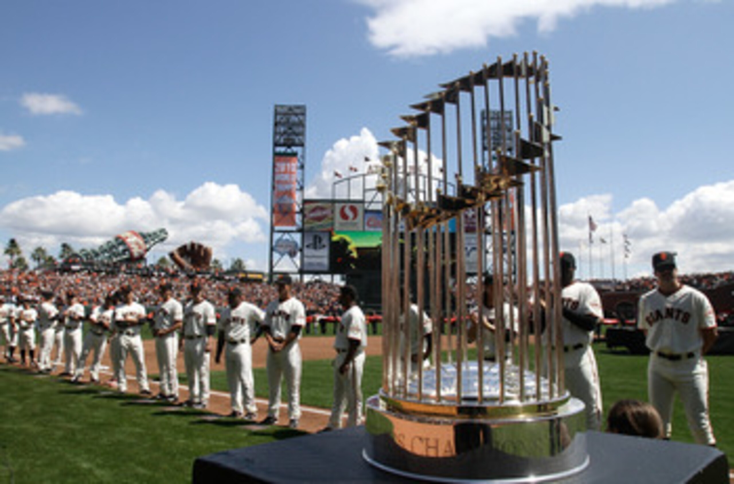 SAN FRANCISCO, CA - APRIL 08:  The 2010 World Series trophy is displayed as San Francisco Giants players line up before the start of the Giants' opening day game against the St. Louis Cardinals at AT&T Park on April 8, 2011 in San Francisco, California.