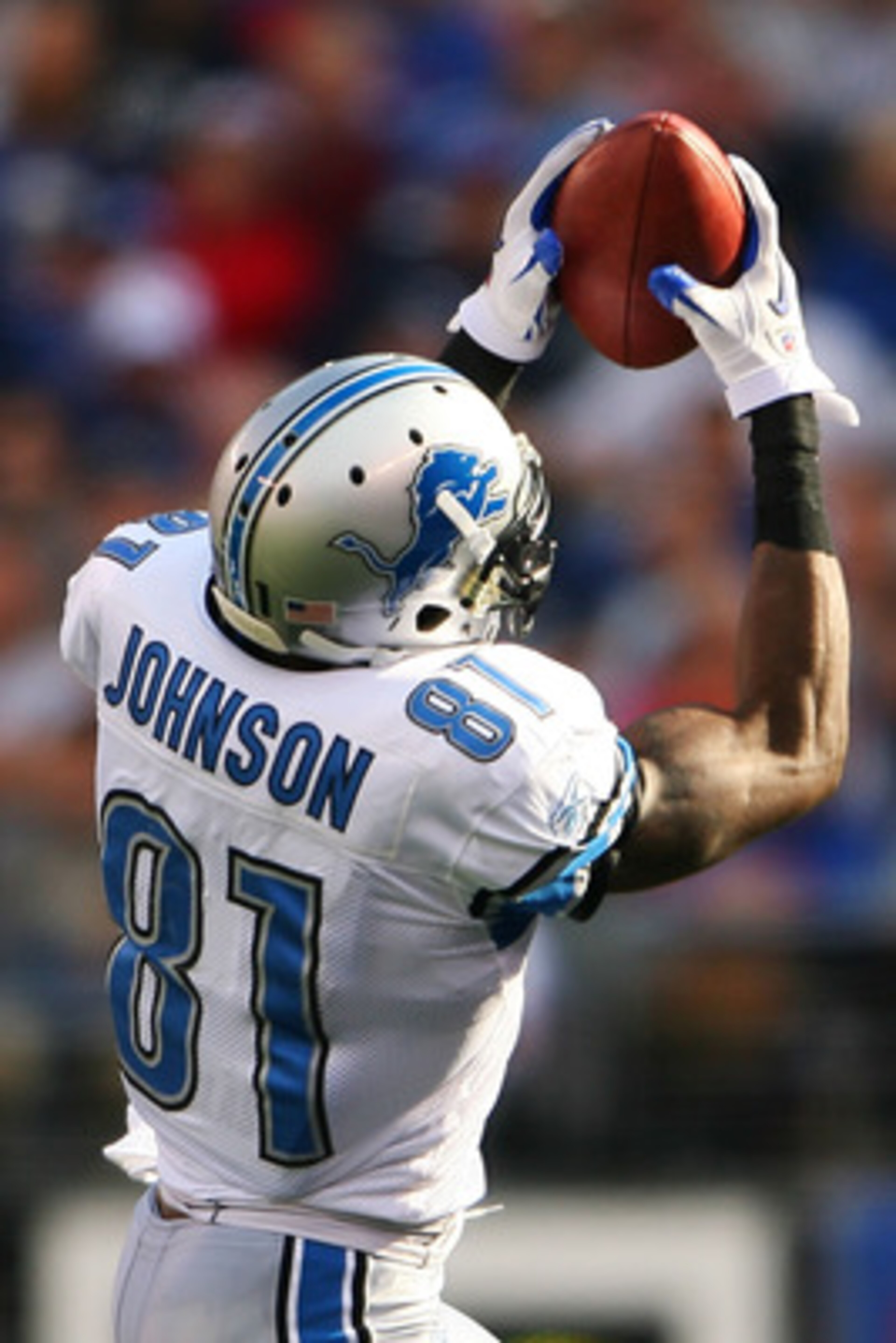 EAST RUTHERFORD, NJ - OCTOBER 17: Calvin Johnson #81 of the Detroit Lions catches the ball on an 87-yard touchdown run in the third quarter against the New York Giants at New Meadowlands Stadium on October 17, 2010 in East Rutherford, New Jersey. The Gian EAST RUTHERFORD, NJ - OCTOBER 17: Calvin Johnson #81 of the Detroit Lions catches the ball on an 87-yard touchdown run in the third quarter against the New York Giants at New Meadowlands Stadium on October 17, 2010 in East Rutherford, New Jersey. The Gian