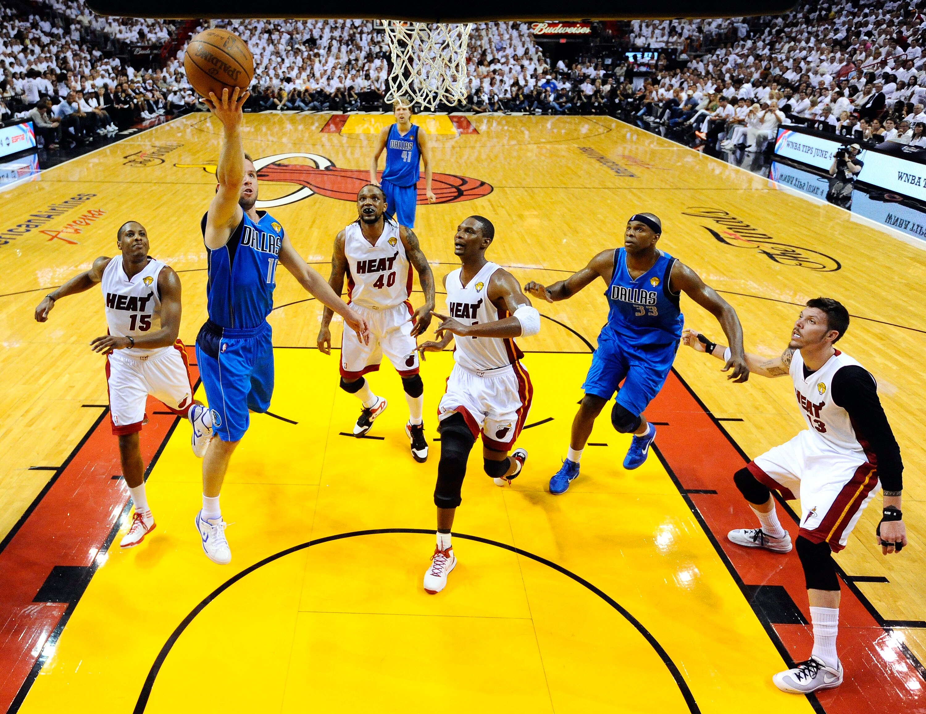 MIAMI, FL - MAY 31: Jose Juan Barea #11 of the Dallas Mavericks lays the ball up against Chris Bosh #1 of the Miami Heat in the first half in Game One of the 2011 NBA Finals at American Airlines Arena on May 31, 2011 in Miami, Florida. NOTE TO USER: User MIAMI, FL - MAY 31: Jose Juan Barea #11 of the Dallas Mavericks lays the ball up against Chris Bosh #1 of the Miami Heat in the first half in Game One of the 2011 NBA Finals at American Airlines Arena on May 31, 2011 in Miami, Florida. NOTE TO USER: User