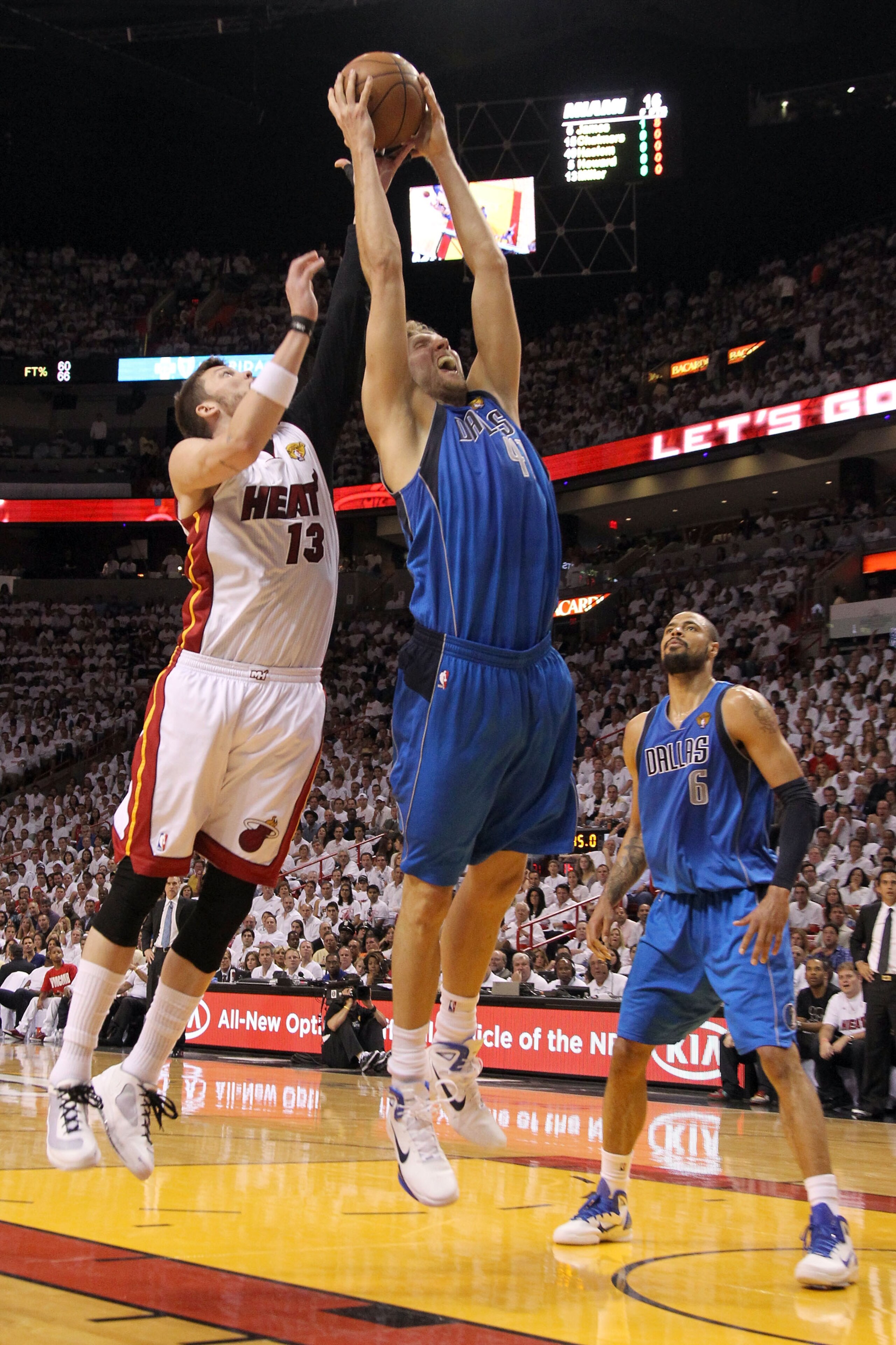 MIAMI, FL - MAY 31:  Dirk Nowitzki #41 of the Dallas Mavericks grabs a rebound against Mike Miller #13 of the Miami Heat in Game One of the 2011 NBA Finals at American Airlines Arena on May 31, 2011 in Miami, Florida. NOTE TO USER: User expressly acknowle