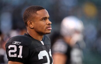 OAKLAND, CA - NOVEMBER 28:  Nnamdi Asomugha #21 of the Oakland Raiders stands on the sidelines during the closing minutes of their loss to the Miami Dolphins at Oakland-Alameda County Coliseum on November 28, 2010 in Oakland, California.  (Photo by Ezra S