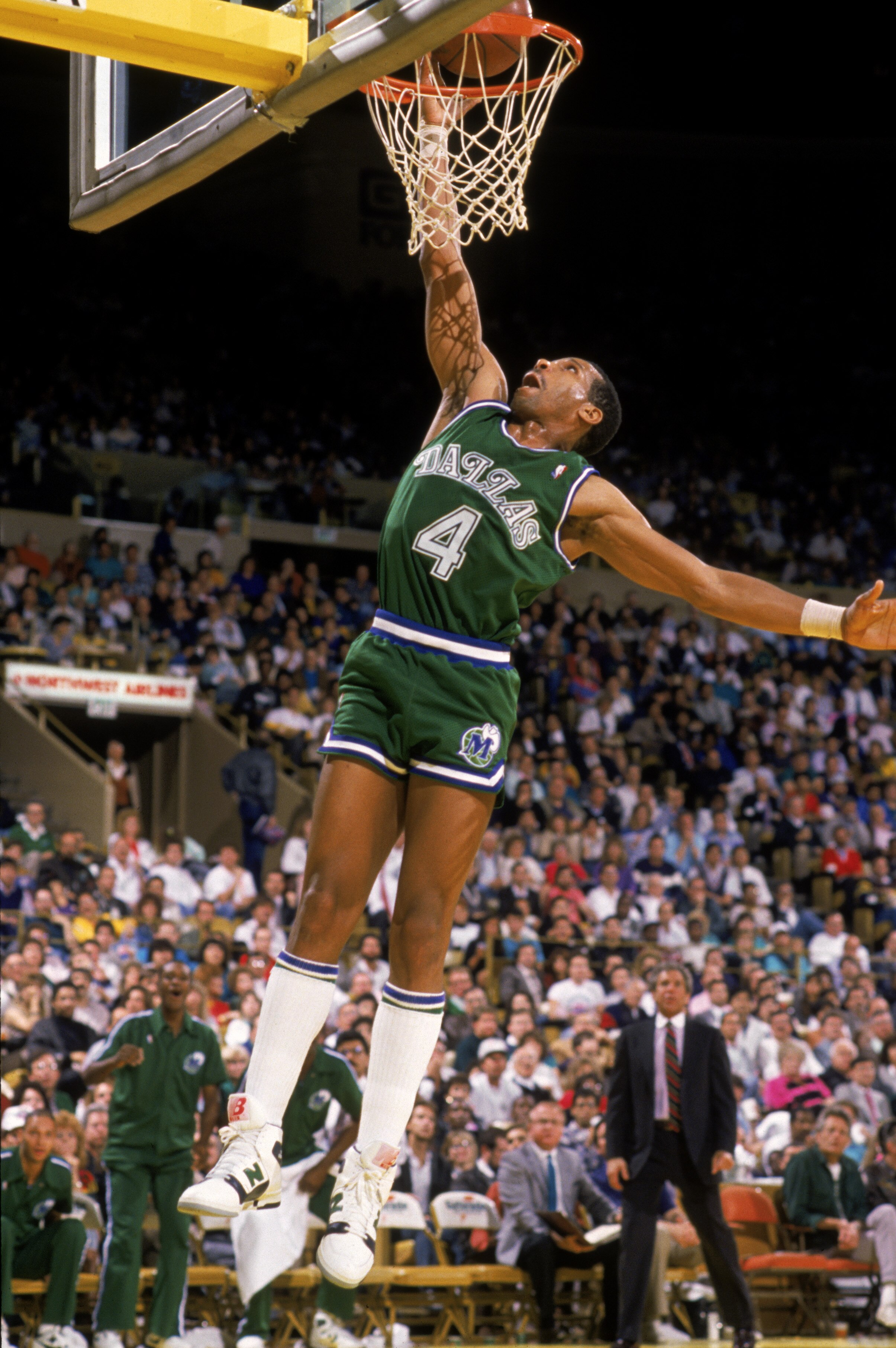 LOS ANGELES - 1989:  Adrian Dantley #4 of the Dallas Mavericks dunks the ball during the NBA game against the Los Angeles Lakers at the Great Western Forum in Los Angeles, California in 1989.  (Photo by Stephen Dunn/Getty Images)