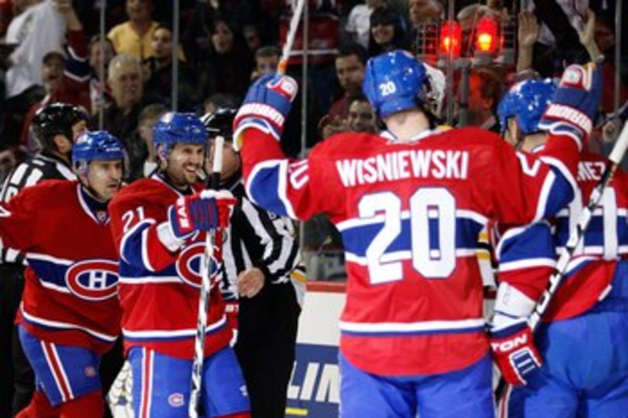 MONTREAL, CANADA - MARCH 8:  Members of the Montreal Canadiens celebrate a second period goal against the Boston Bruins during the NHL game at the Bell Centre on March 8, 2011 in Montreal, Quebec, Canada.  The Canadiens defeated the Bruins 4-1.  (Photo by