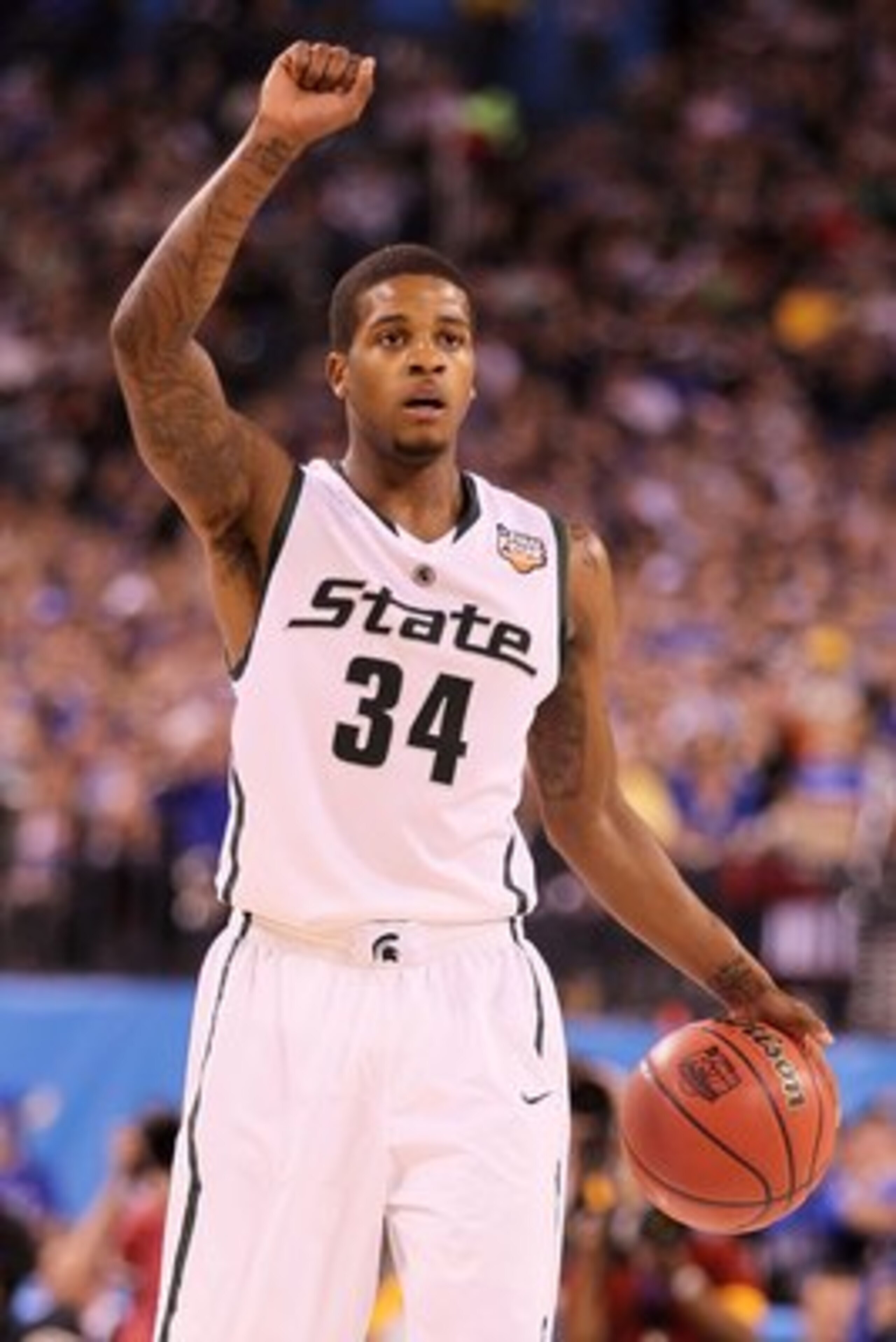 INDIANAPOLIS - APRIL 03:  Korie Lucious #34 of the Michigan State Spartans with the ball against the Butler Bulldogs during the National Semifinal game of the 2010 NCAA Division I Men's Basketball Championship on April 3, 2010 in Indianapolis, Indiana.  (