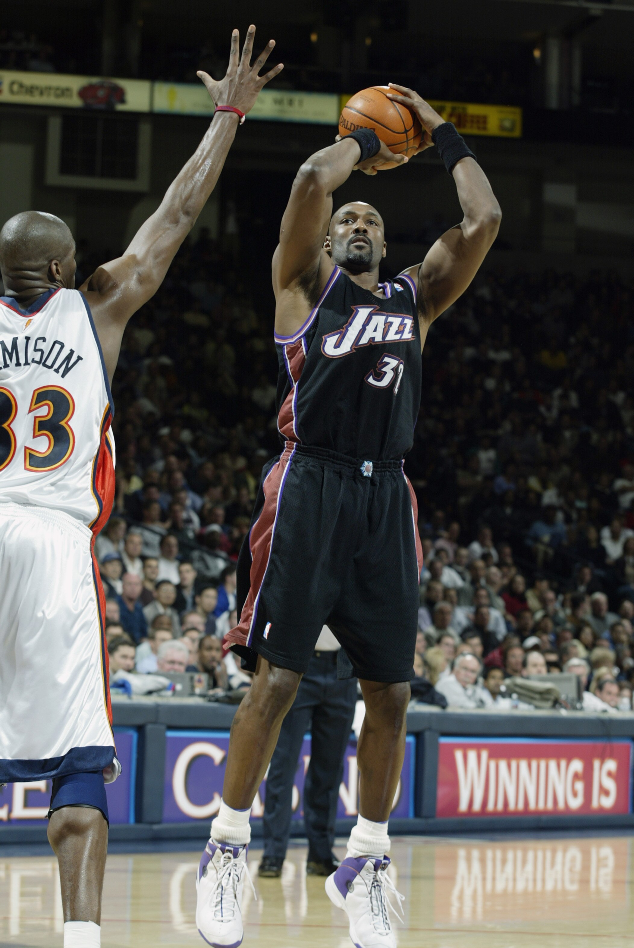 OAKLAND, CA - APRIL 8:  Karl Malone #32 of the Utah Jazz shoots over Antawn Jamison #33 of the Golden State Warriors during the game at The Arena in Oakland on April 8, 2003 in Oakland, California.  The Warriors won 128-102.  NOTE TO USER: User expressly 