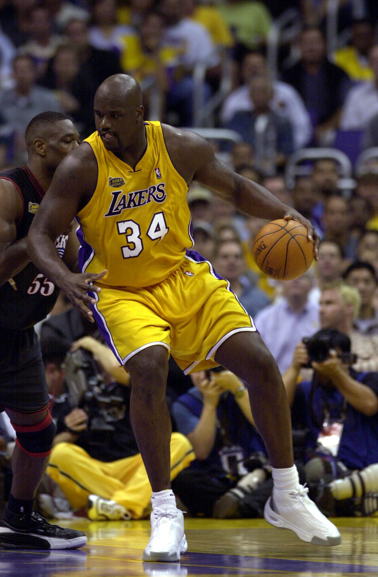 6 Jun 2001:  Shaquille O''Neal #34 of the Los Angeles Lakers is defended by Dikembe Mutombo #55 of the Philadelphia 76ers in game one of the NBA Finals at Staples Center in Los Angeles, California.  The 76ers won 107-101.  DIGITAL IMAGE.  Mandatory Credit