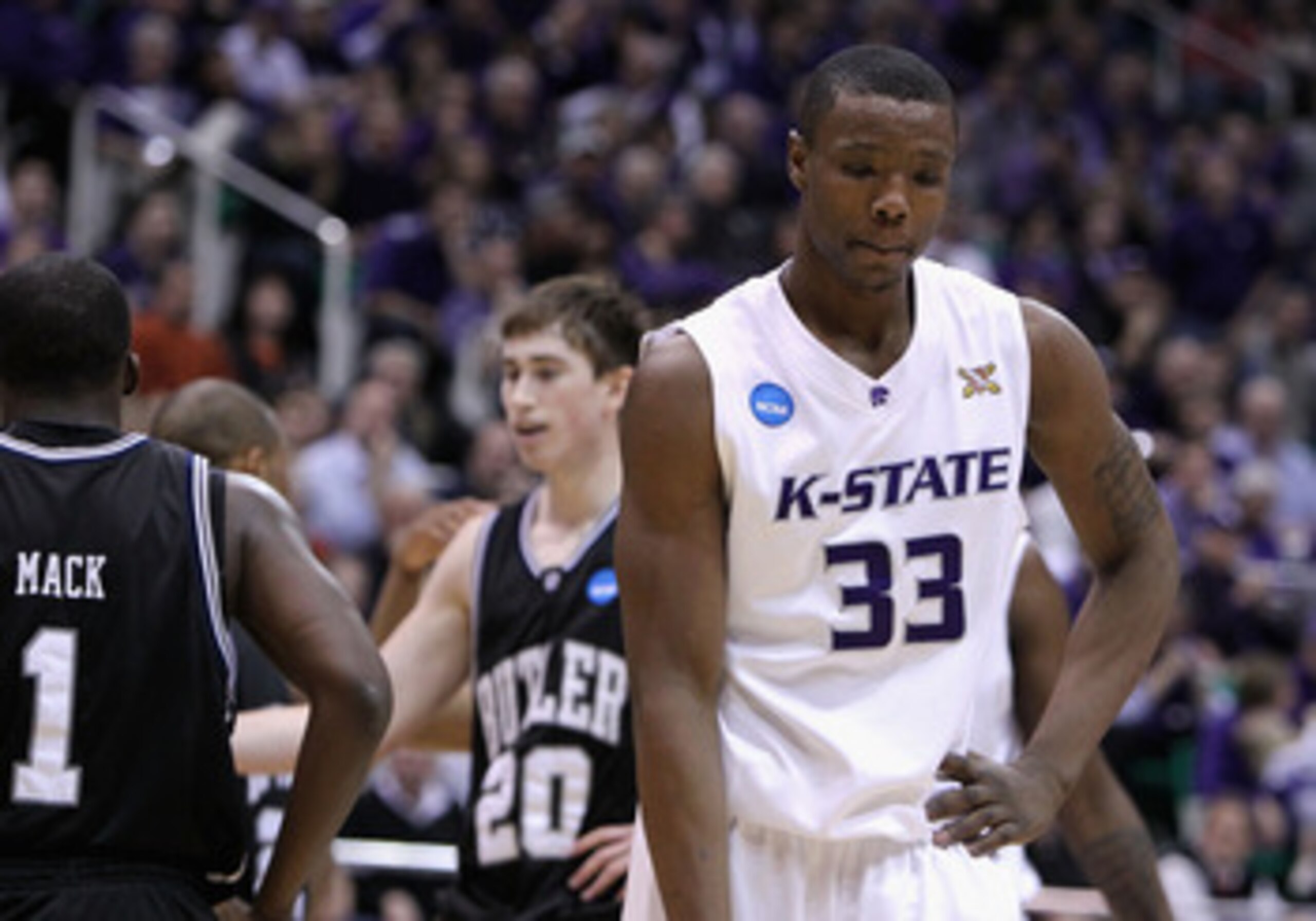 SALT LAKE CITY - MARCH 27:  Wally Judge #33 of the Kansas State Wildcats reacts after being called for a foul against Gordon Hayward #20 of the Butler Bulldogs during the west regional final of the 2010 NCAA men's basketball tournament at the Energy Solut