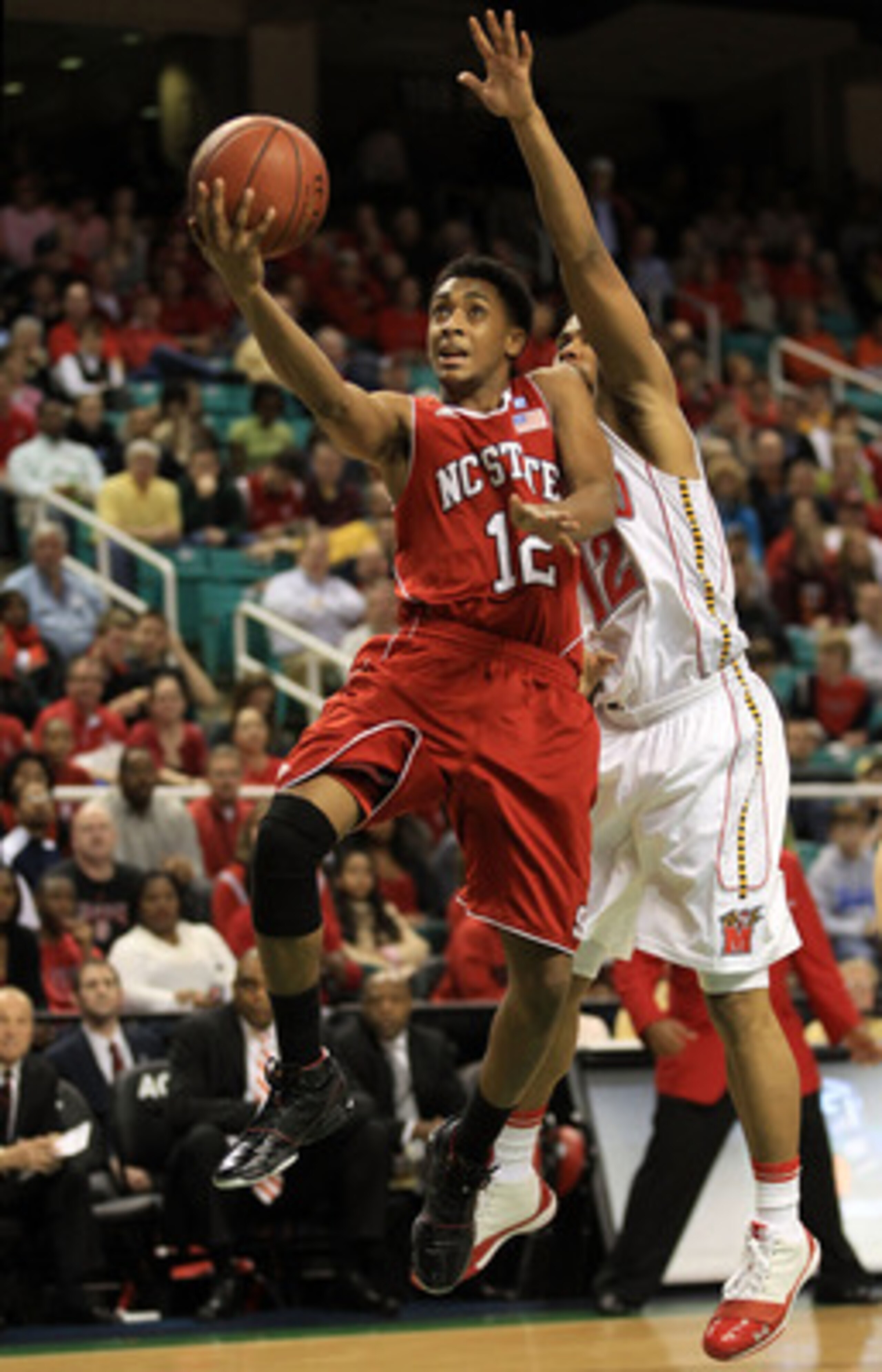 GREENSBORO, NC - MARCH 10:  Terrell Stoglin #12 of the Maryland Terrapins shoots against Ryan Harrow #12 of the North Carolina State Wolfpack during the second half of the game in the first round of the 2011 ACC men's basketball tournament at the Greensbo