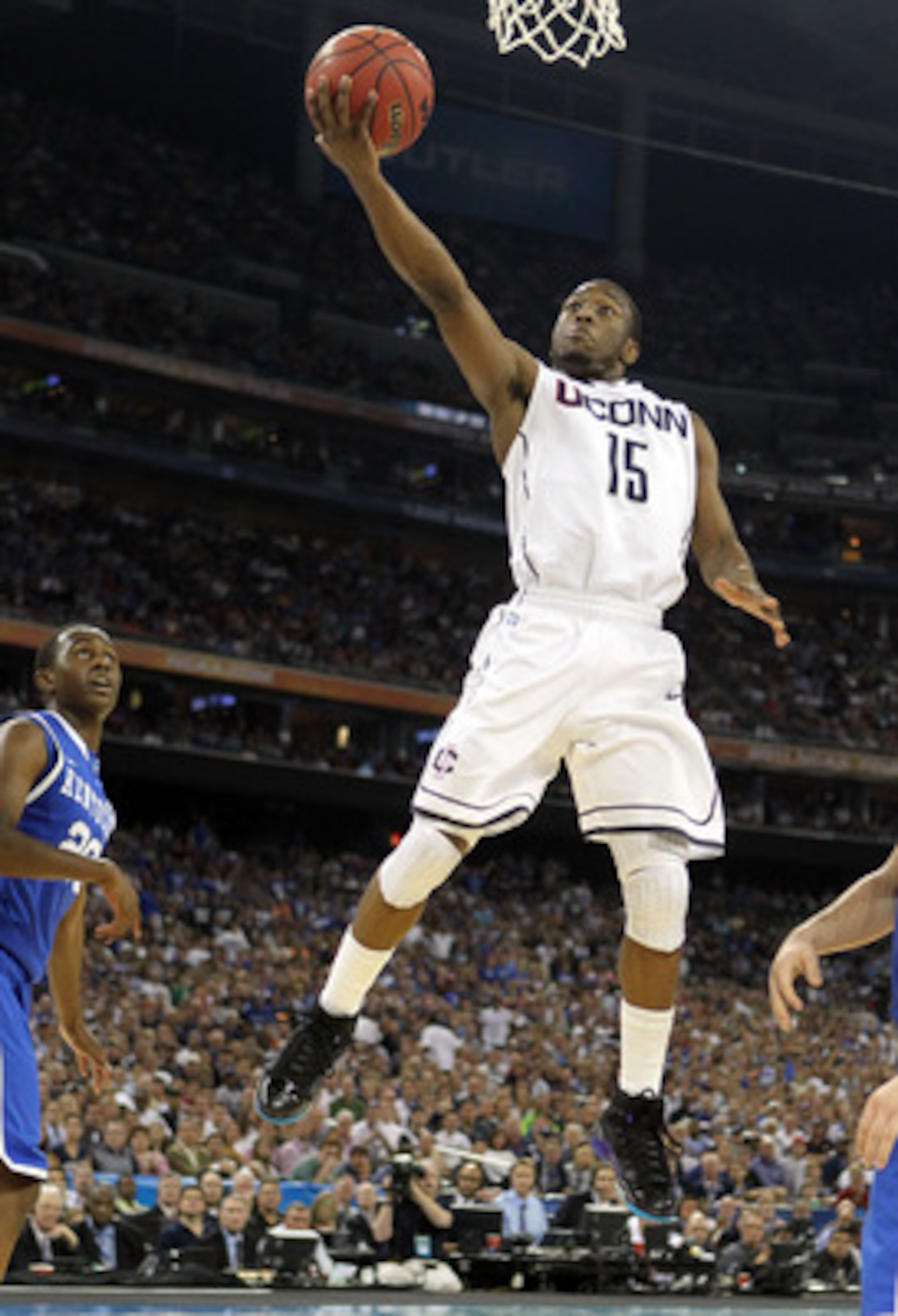 HOUSTON, TX - APRIL 02:  Kemba Walker #15 of the Connecticut Huskies goes to the hoop against the Kentucky Wildcats during the National Semifinal game of the 2011 NCAA Division I Men's Basketball Championship at Reliant Stadium on April 2, 2011 in Houston