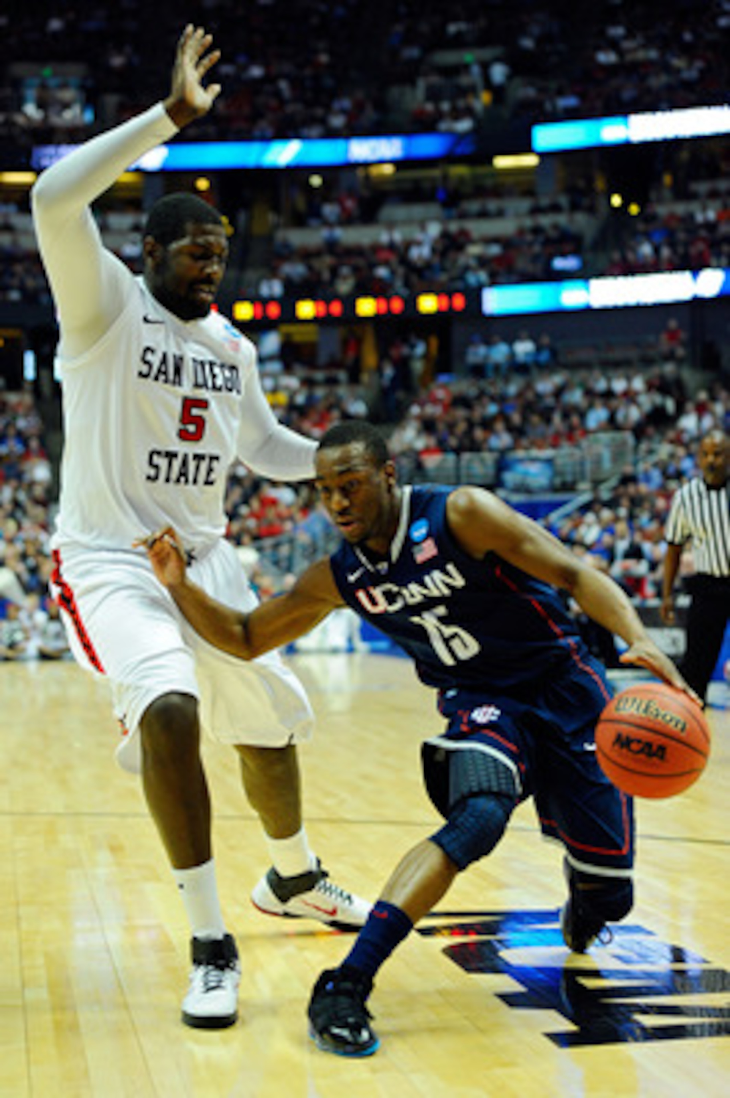 ANAHEIM, CA - MARCH 24:  Kemba Walker #15 of the Connecticut Huskies handles the ball against Brian Carlwell #5 of the San Diego State Aztecs during the west regional semifinal of the 2011 NCAA men's basketball tournament at the Honda Center on March 24, 