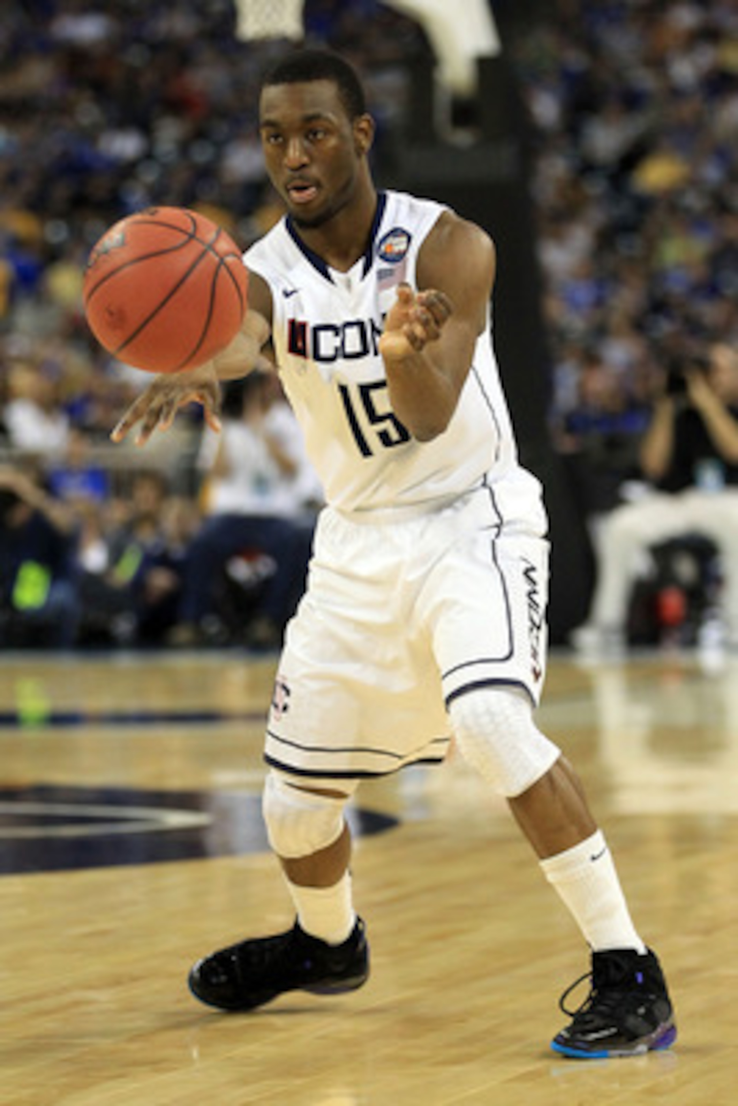HOUSTON, TX - APRIL 02:  Kemba Walker #15 of the Connecticut Huskies passes the ball against the Kentucky Wildcats during the National Semifinal game of the 2011 NCAA Division I Men's Basketball Championship at Reliant Stadium on April 2, 2011 in Houston,