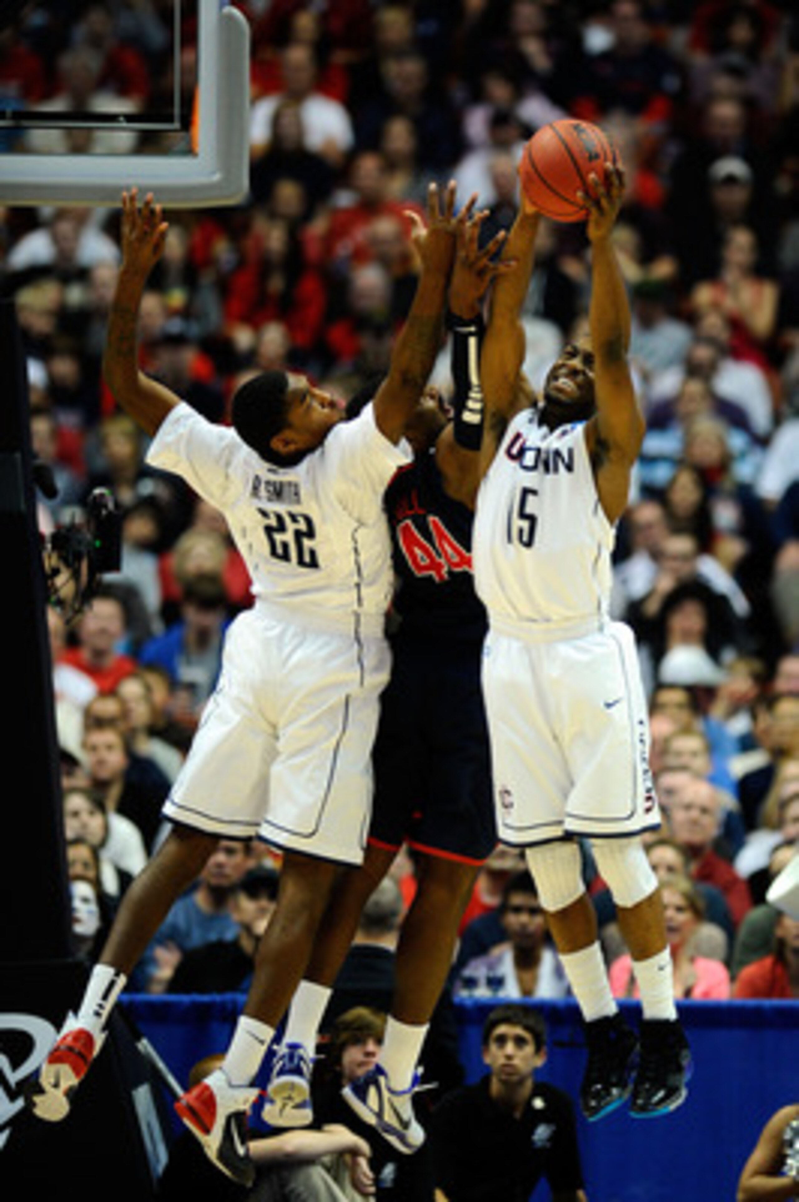 ANAHEIM, CA - MARCH 26:  Kemba Walker #15 and Roscoe Smith #22 of the Connecticut Huskies go up for a rebound against Derrick Williams #23 of the Arizona Wildcats during the west regional final of the 2011 NCAA men's basketball tournament at the Honda Cen