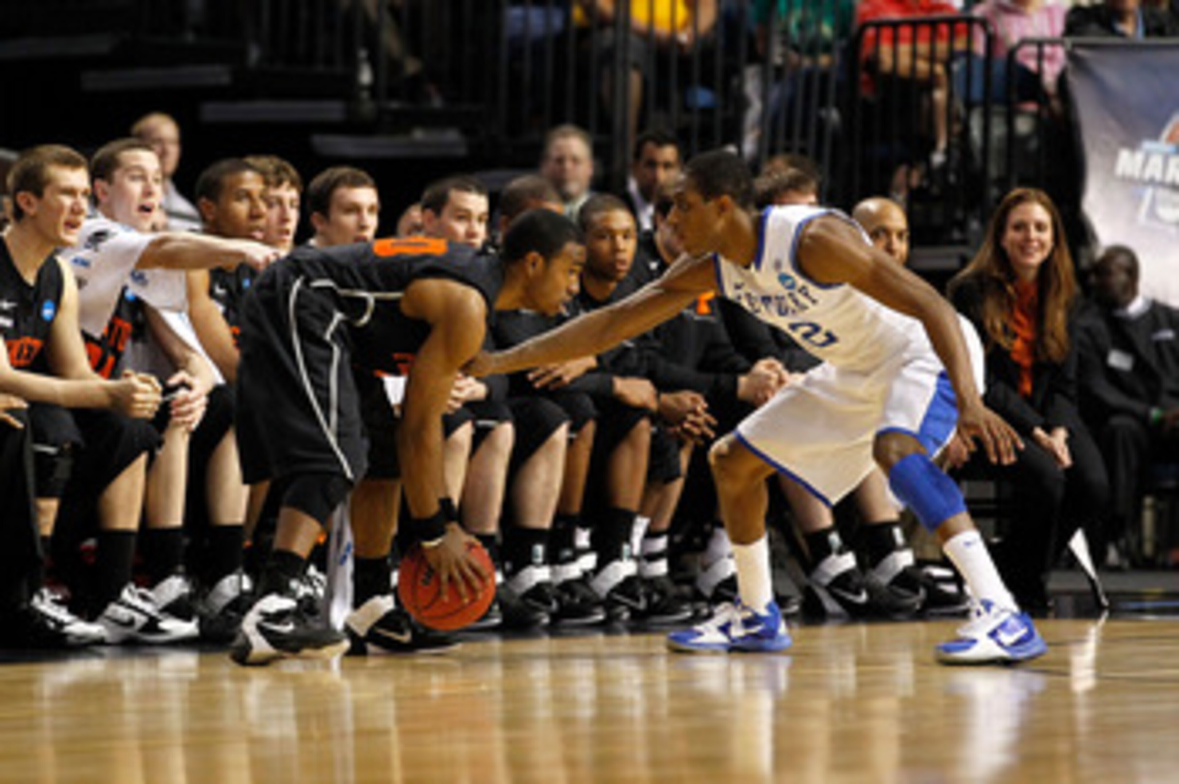 TAMPA, FL - MARCH 17:  Douglas Davis #20 of the Princeton Tigers looks to drive against Brandon Knight #12 of the Kentucky Wildcats during the second round of the 2011 NCAA men's basketball tournament at St. Pete Times Forum on March 17, 2011 in Tampa, Fl