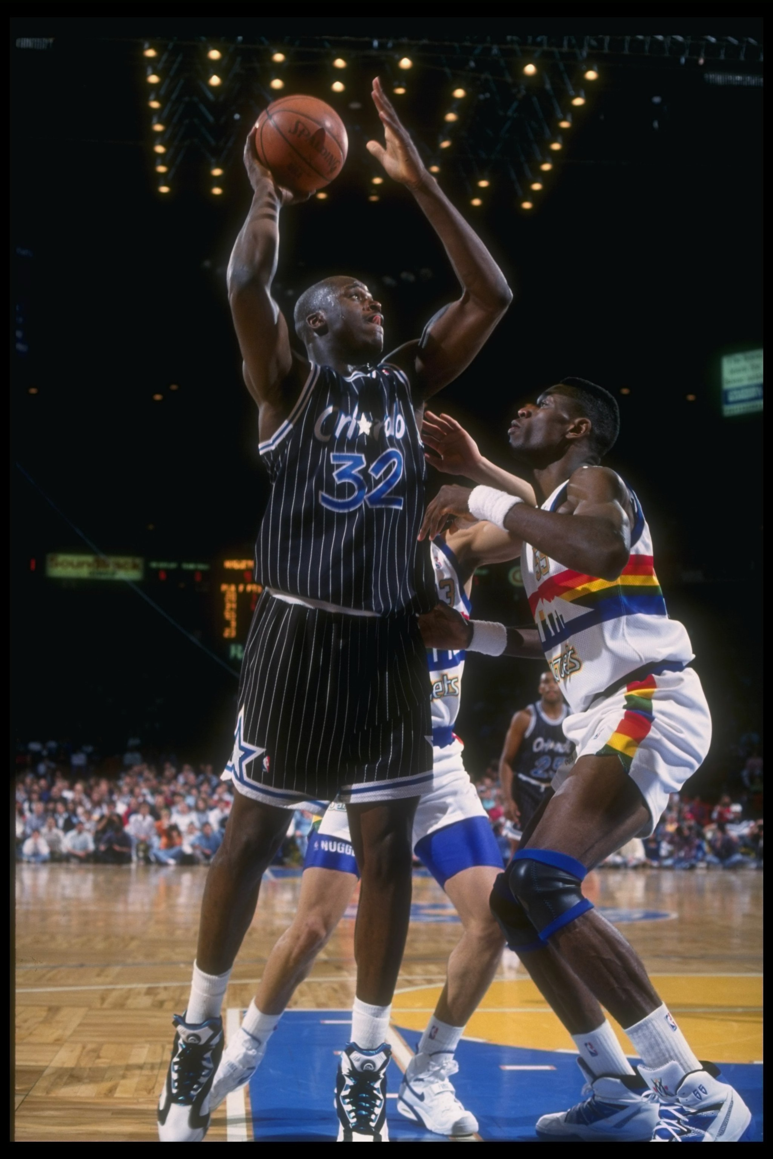 1992-1993:  Center Shaquille O''Neal of the Orlando Magic looks to shoot the ball during a game against the Denver Nuggets at McNichols Arena in Denver, Colorado. Mandatory Credit: Tim DeFrisco  /Allsport Mandatory Credit: Tim DeFrisco  /Allsport