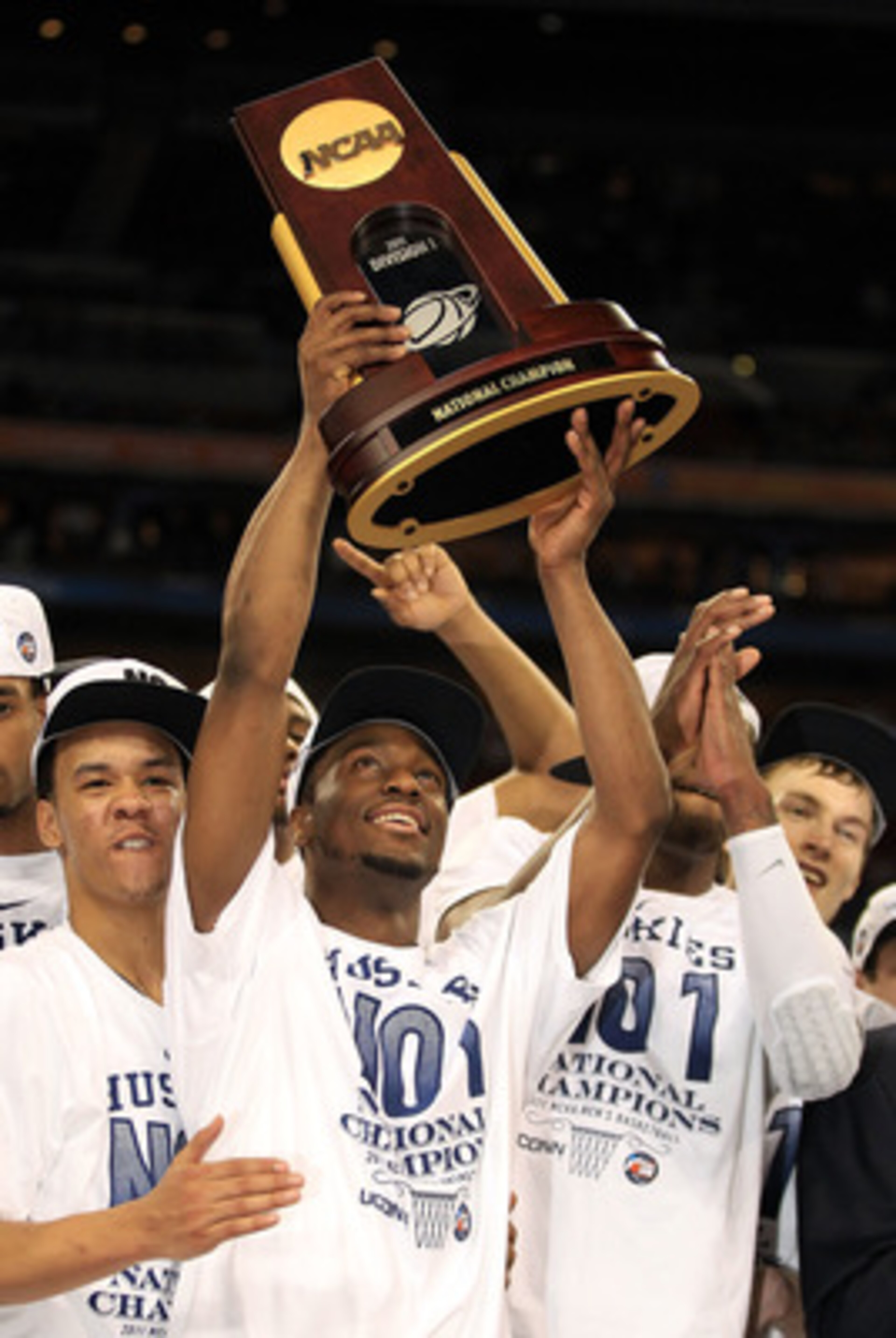 HOUSTON, TX - APRIL 04:  Shabazz Napier #13 and Kemba Walker #15 of the Connecticut Huskies celebrate with the trophy after defeating the Butler Bulldogs to win the National Championship Game of the 2011 NCAA Division I Men's Basketball Tournament by a sc