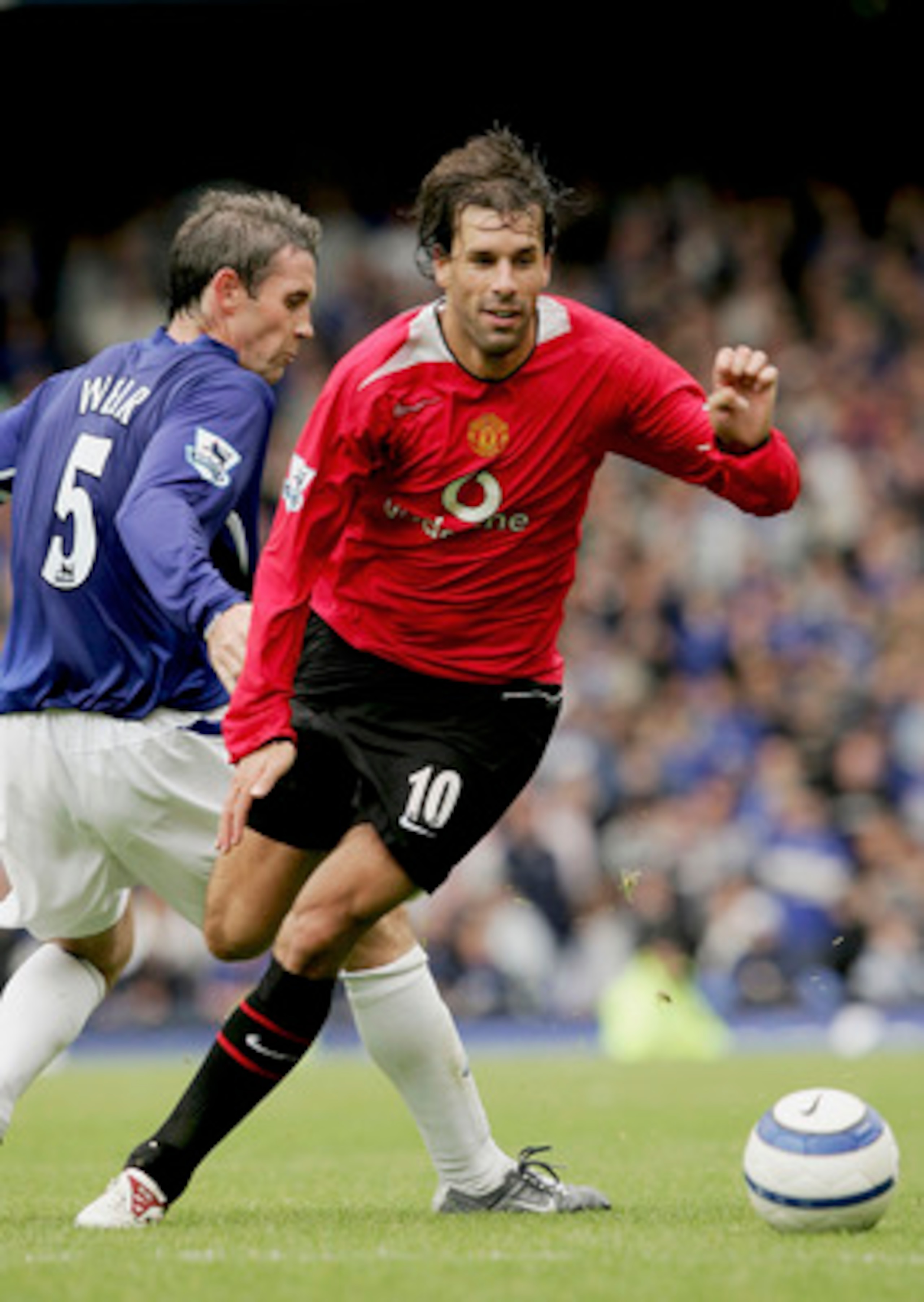 LIVERPOOL, ENGLAND -  AUGUST 13 : Ruud Van Nistelrooy of Man Utd moves away from David Weir of Everton during the Barclays Premiership match between Everton and Manchester United at Goodison Park on August 13, 2005 in Liverpool, England.  (Photo by Clive 