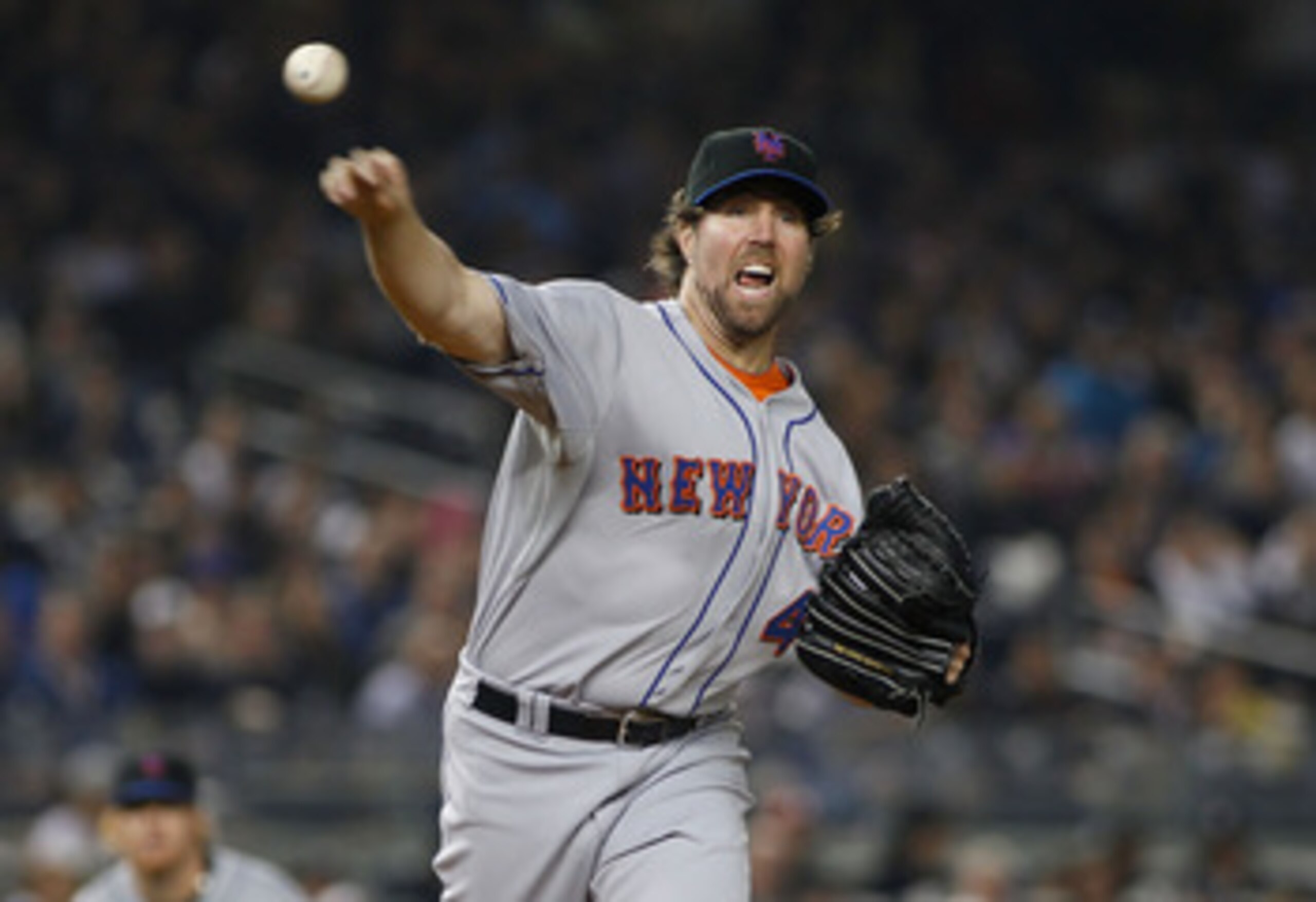 NEW YORK - MAY 20: R.A. Dickey #43 of the New York Mets atempts to pickoff Brett Gardner #11 of the New York Yankees (not pictured) on May 20, 2011 at Yankee Stadium in the Bronx borough of New York City. (Photo by Mike Stobe/Getty Images) NEW YORK - MAY 20: R.A. Dickey #43 of the New York Mets atempts to pickoff Brett Gardner #11 of the New York Yankees (not pictured) on May 20, 2011 at Yankee Stadium in the Bronx borough of New York City. (Photo by Mike Stobe/Getty Images)