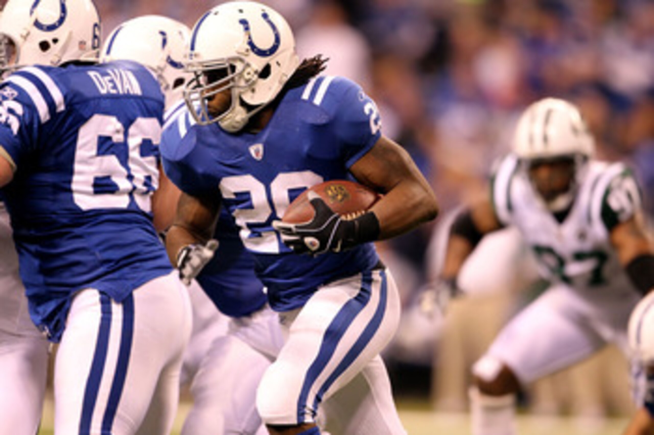 INDIANAPOLIS, IN - JANUARY 08: Joseph Addai #29 of the Indianapolis Colts runs the ball against the New York Jets during their 2011 AFC wild card playoff game at Lucas Oil Stadium on January 8, 2011 in Indianapolis, Indiana. The Jets won 17-16. (Photo by INDIANAPOLIS, IN - JANUARY 08: Joseph Addai #29 of the Indianapolis Colts runs the ball against the New York Jets during their 2011 AFC wild card playoff game at Lucas Oil Stadium on January 8, 2011 in Indianapolis, Indiana. The Jets won 17-16. (Photo by