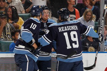 SUNRISE, FL - APRIL 2: Jack Skille #15 is congratulated by David Booth #10 and Marty Reasoner #19 of the Florida Panthers after scoring his first goal as a Panther against the Pittsburgh Penguins on April 2, 2011 at the BankAtlantic Center in Sunrise, Flo