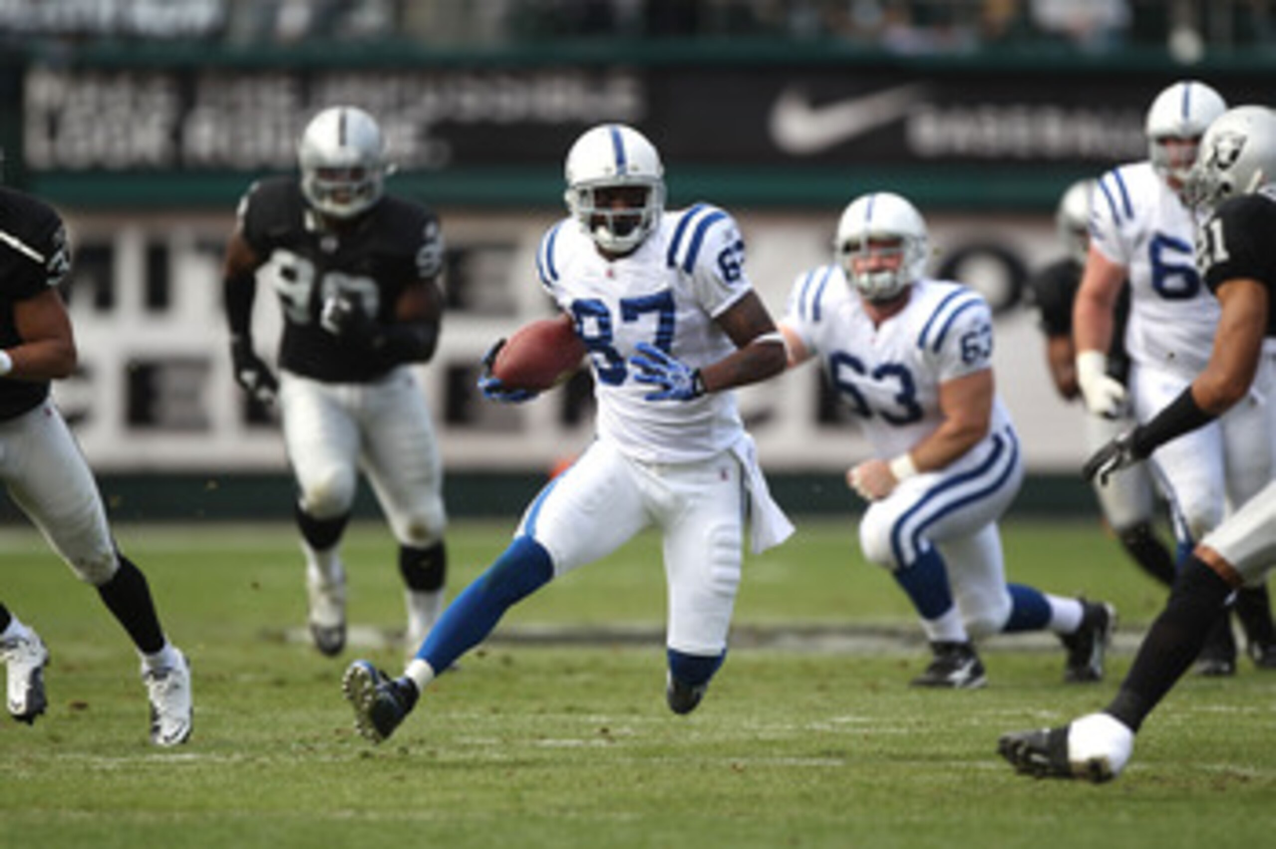 OAKLAND, CA - DECEMBER 26: Reggie Wayne #87 of the Indianapolis Colts runs after a catch against the Oakland Raiders during an NFL game at Oakland-Alameda County Coliseum on December 26, 2010 in Oakland, California. (Photo by Jed Jacobsohn/Getty Images OAKLAND, CA - DECEMBER 26: Reggie Wayne #87 of the Indianapolis Colts runs after a catch against the Oakland Raiders during an NFL game at Oakland-Alameda County Coliseum on December 26, 2010 in Oakland, California. (Photo by Jed Jacobsohn/Getty Images