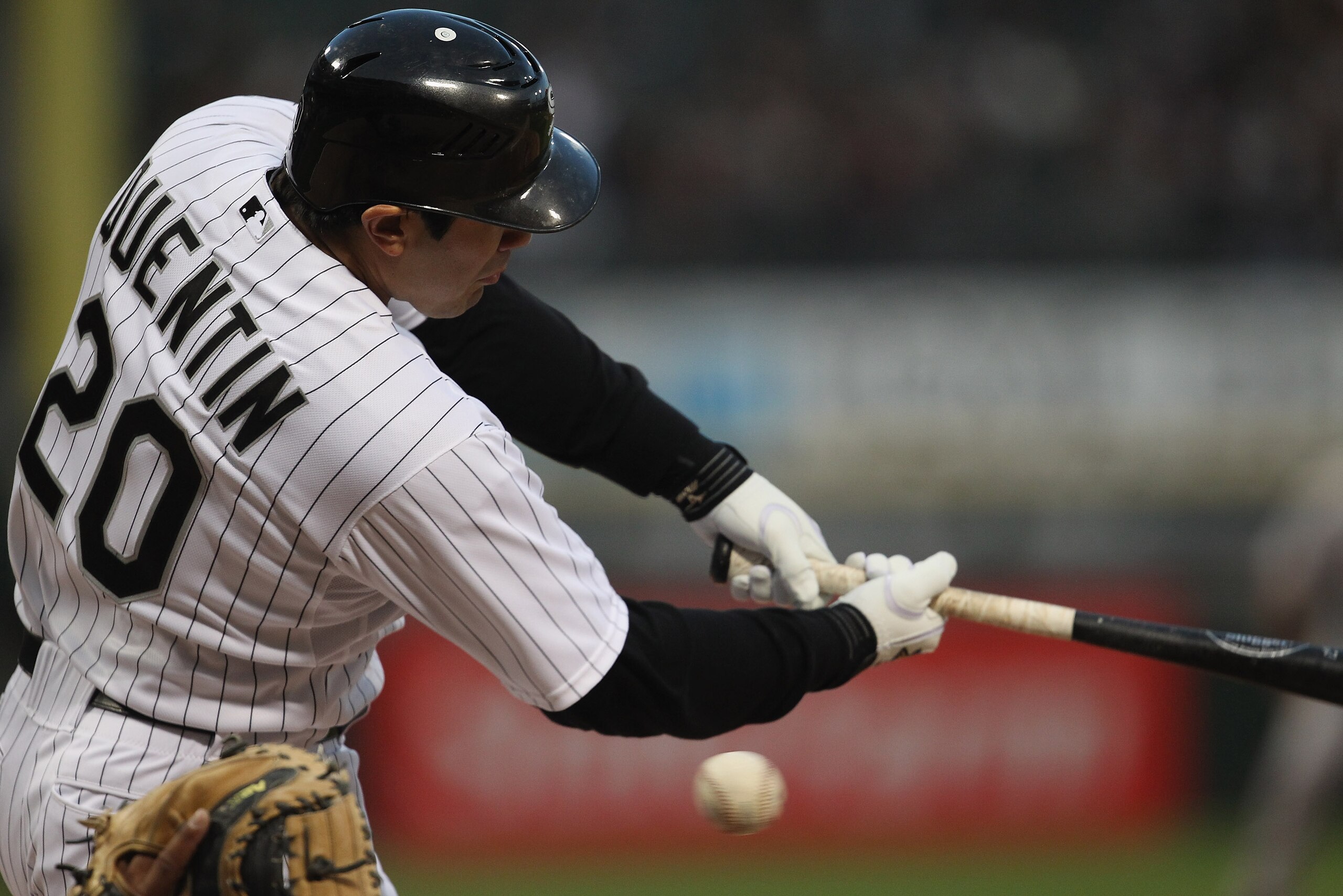 CHICAGO, IL - MAY 17: Carlos Quentin #20 of the Chicago White Sox misses the ball on a swing against the Texas Rangers at U.S. Cellular Field on May 17, 2011 in Chicago, Illinois. (Photo by Jonathan Daniel/Getty Images)