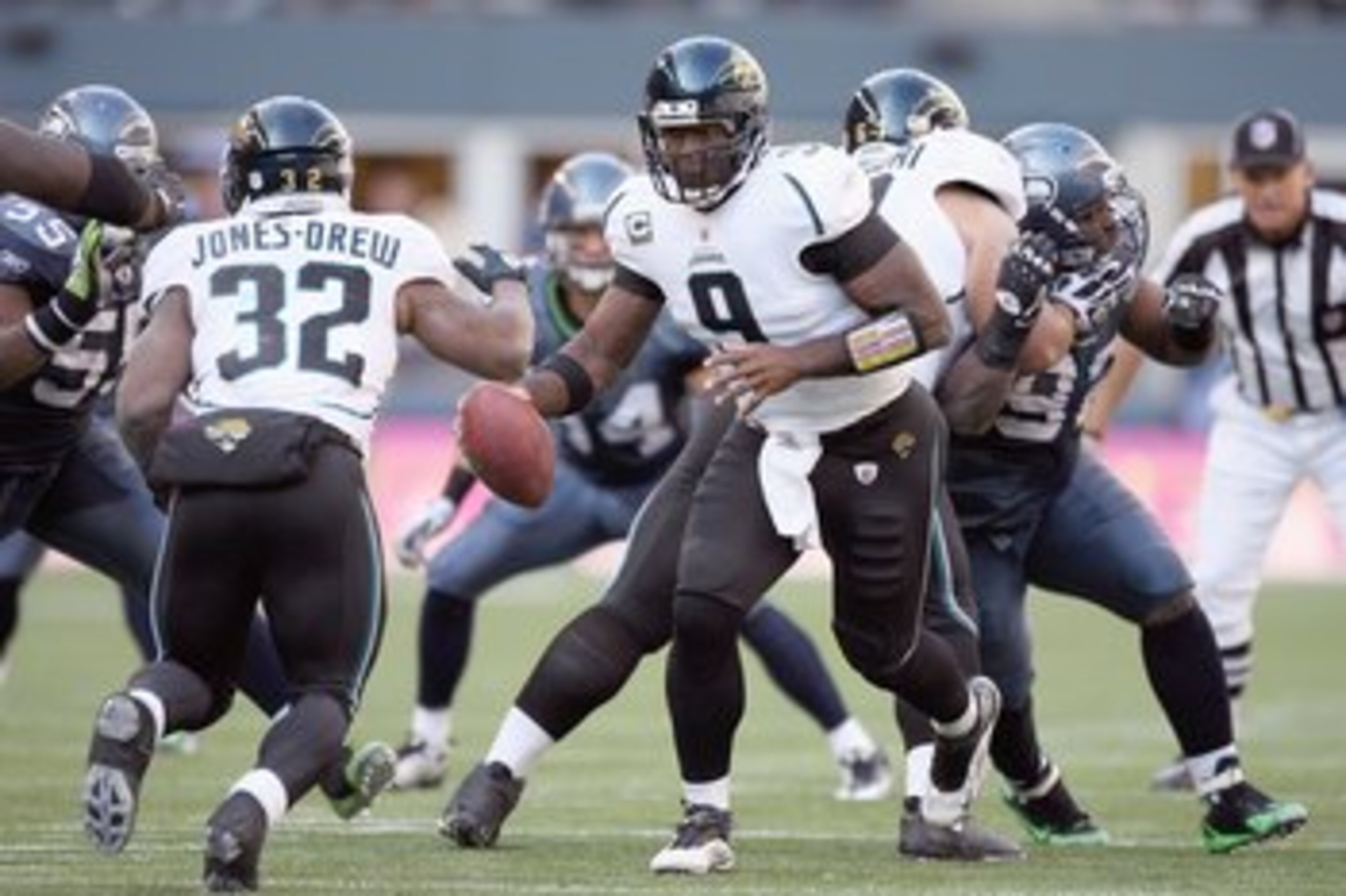 SEATTLE - OCTOBER 11:  Quarterback David Gerrard #9 of the Jacksonville Jaguars hands off the ball to Maurice Jones -Drew #32 during the game against the Seattle Seahawks on October 11, 2009 at Qwest Field in Seattle, Washington. The Seahawks defeated the