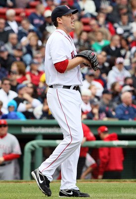 BOSTON, MA - MAY 05:  John Lackey #41 of the Boston Red Sox heads back to the mound after Erick Aybar and Torii Hunter of the Los Angeles Angels scored in the third inning on May 5, 2011 at Fenway Park in Boston, Massachusetts.  (Photo by Elsa/Getty Image