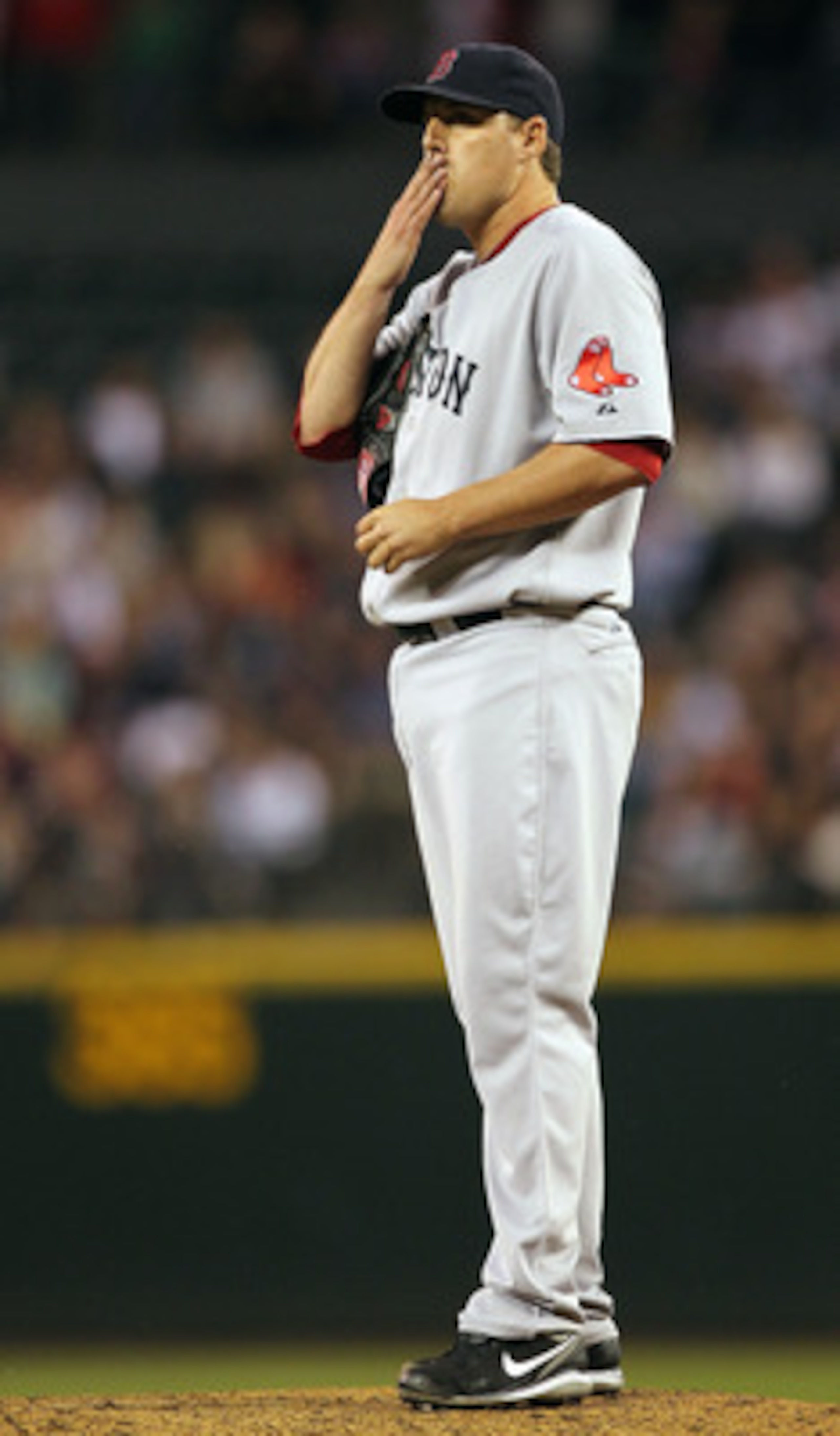 SEATTLE - JULY 22: Starting pitcher John Lackey #40 of the Boston Red Sox reacts after yielding a base hit to Josh Bard #26 of the Seattle Mariners at Safeco Field on July 22, 2010 in Seattle, Washington. The hit broke up a no-hitter in the eighth inning SEATTLE - JULY 22: Starting pitcher John Lackey #40 of the Boston Red Sox reacts after yielding a base hit to Josh Bard #26 of the Seattle Mariners at Safeco Field on July 22, 2010 in Seattle, Washington. The hit broke up a no-hitter in the eighth inning