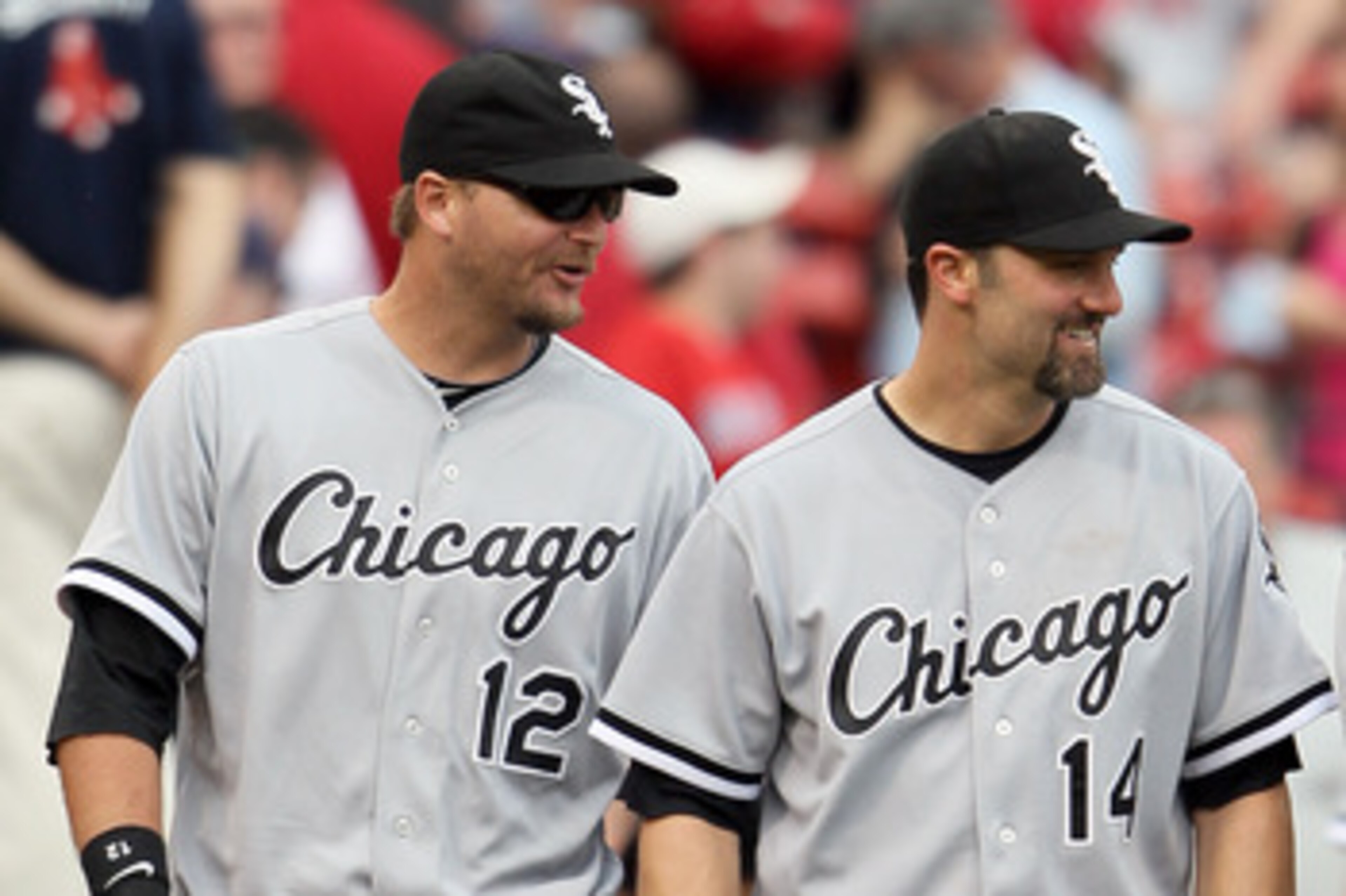BOSTON, MA - JUNE 01:  A.J. Pierzynski #12 and Paul Konerko #14 of the Chicago White Sox celebrate the win over the Boston Red Sox on June 1, 2011 at Fenway Park in Boston, Massachusetts. The Chicago White Sox defeated the Boston Red Sox 7-4.  (Photo by E