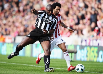 STOKE ON TRENT, ENGLAND - MARCH 19:  Jermaine Pennant of Stoke City battles with Sol Campbell of Newcastle United during the Barclays Premier League match between Stoke City and Newcastle United at Britannia Stadium on March 19, 2011 in Stoke on Trent, En