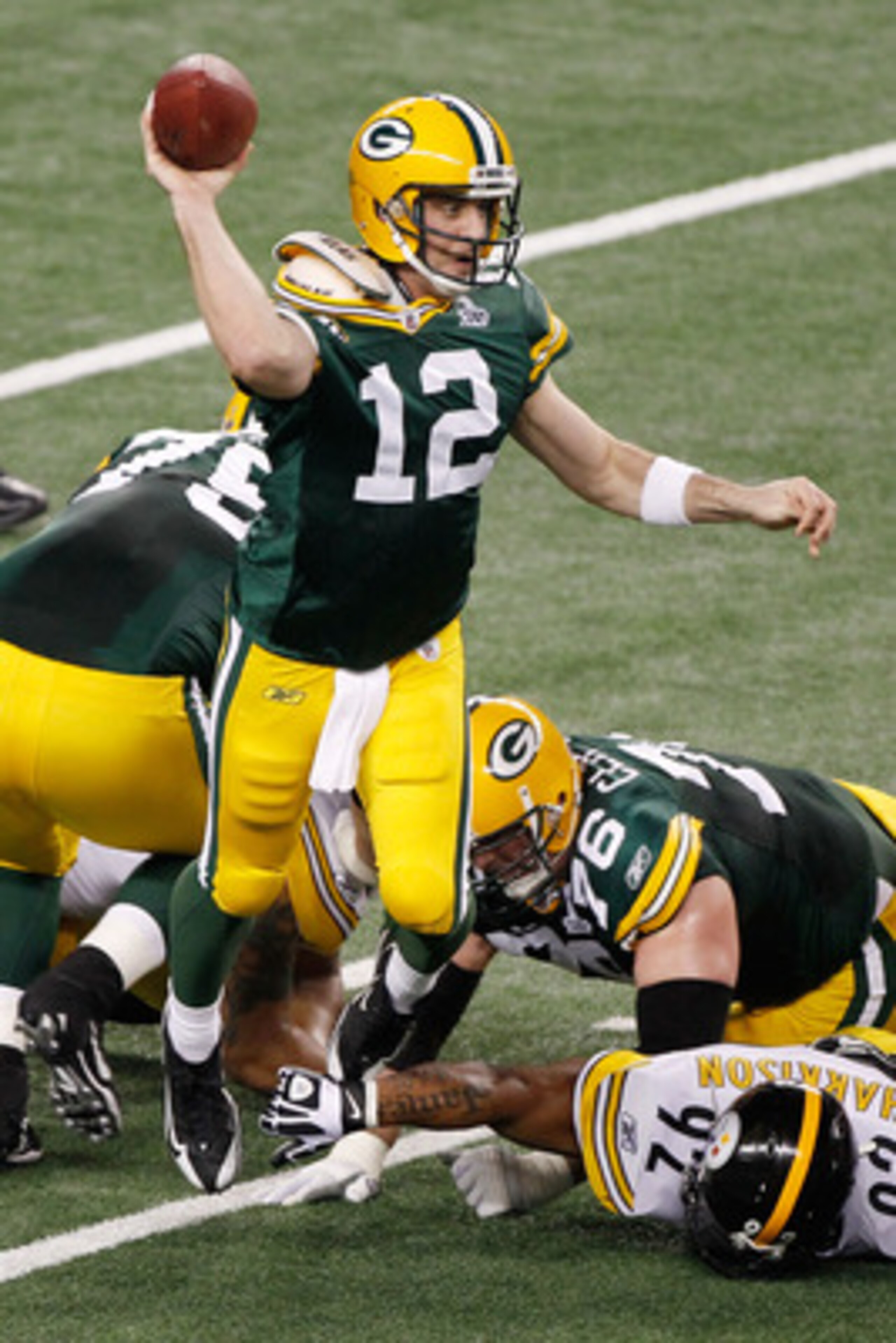 ARLINGTON, TX - FEBRUARY 06: Aaron Rodgers #12 of the Green Bay Packers drops back against the Pittsburgh Steelers in the second quarter of Super Bowl XLV at Cowboys Stadium on February 6, 2011 in Arlington, Texas. (Photo by Joe Robbins/Getty Images) ARLINGTON, TX - FEBRUARY 06: Aaron Rodgers #12 of the Green Bay Packers drops back against the Pittsburgh Steelers in the second quarter of Super Bowl XLV at Cowboys Stadium on February 6, 2011 in Arlington, Texas. (Photo by Joe Robbins/Getty Images)