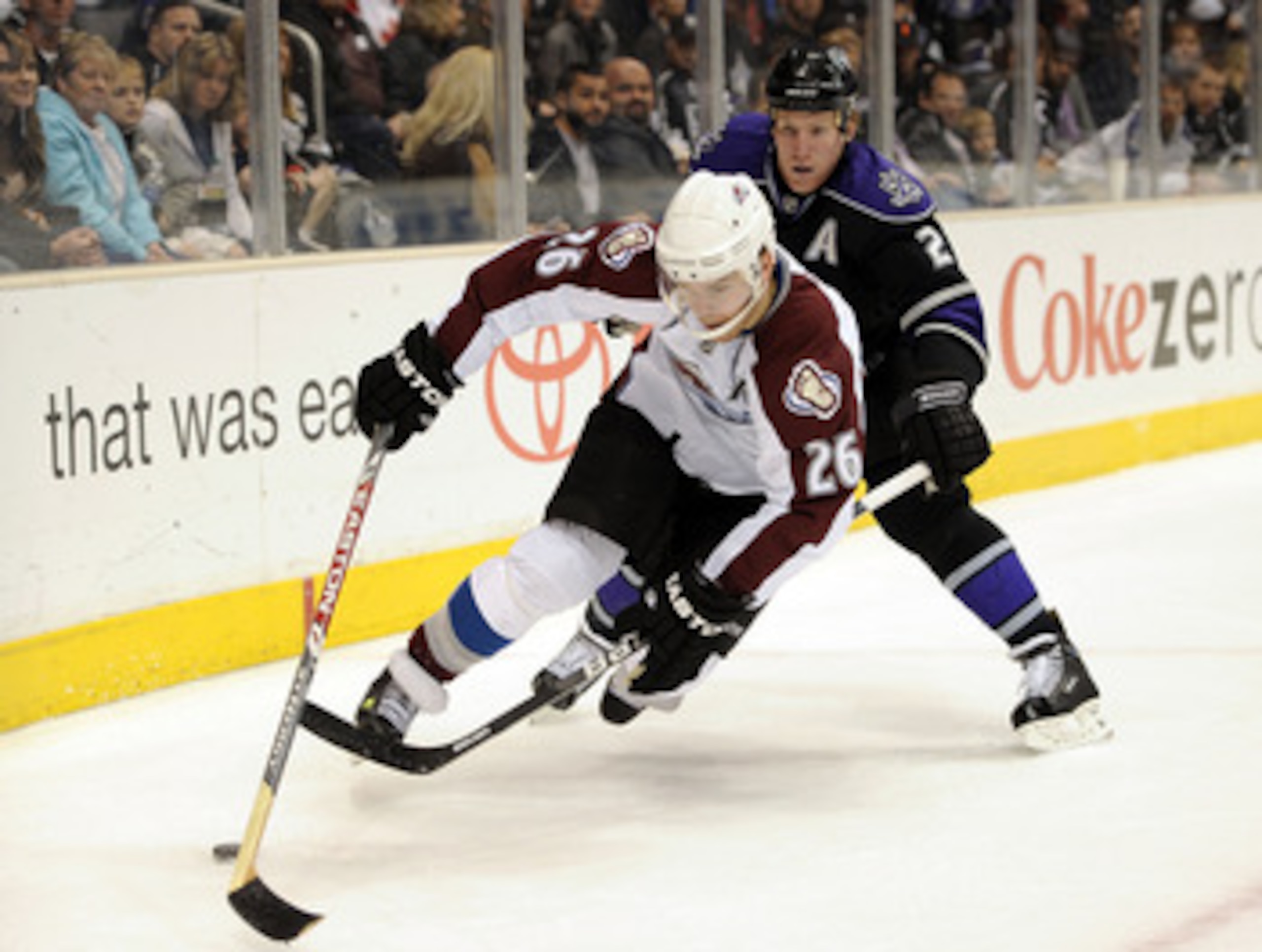 LOS ANGELES, CA - MARCH 22:  Paul Stasny #26 of the Colorado Avalanche is taken down by Matt Greene #2 of the Los Angeles Kings for a penalty during the first period on March 22, 2010 in Los Angeles, California.  (Photo by Harry How/Getty Images)