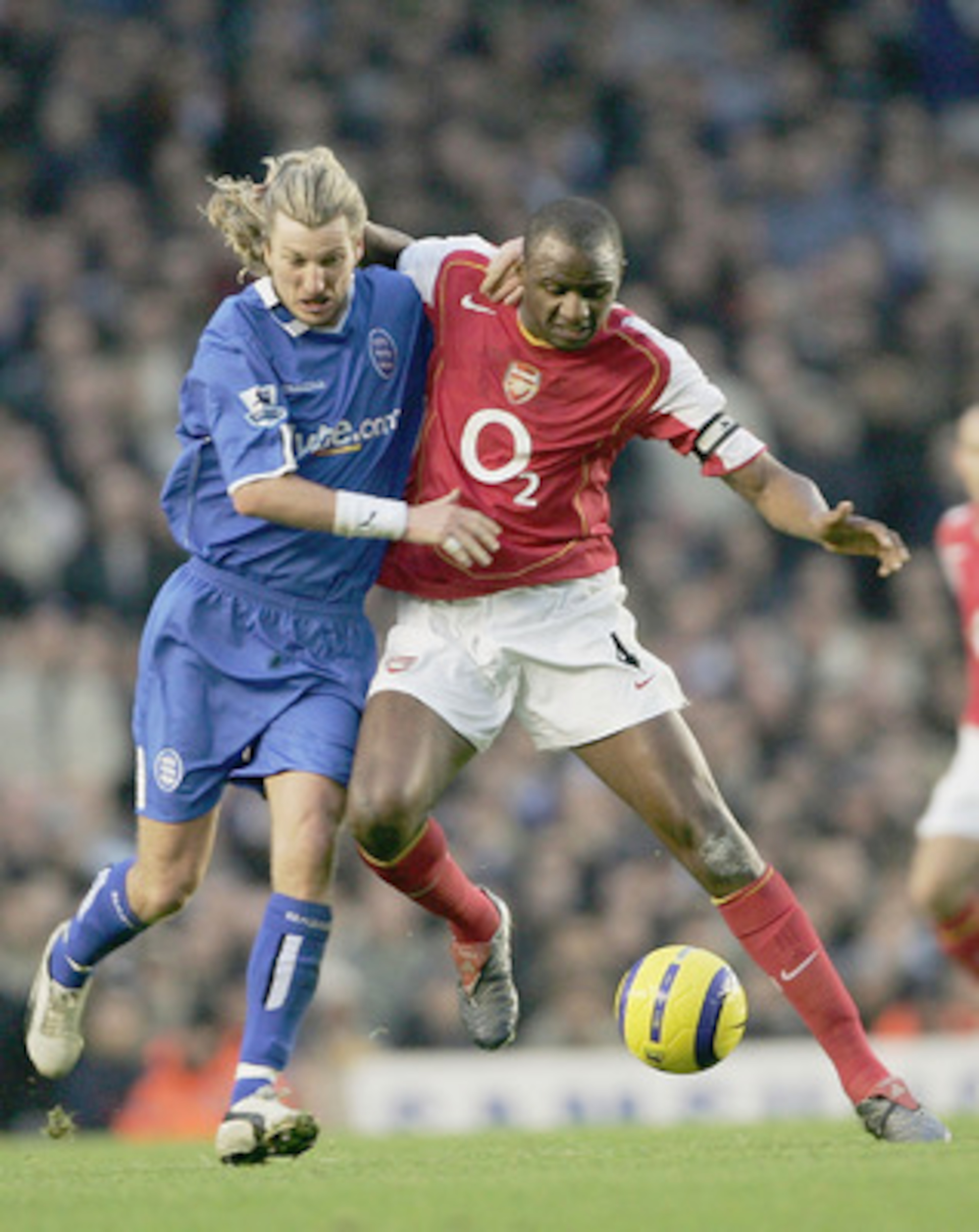LONDON - DECEMBER 04: Robbie Savage of Birmingham City and Partick Vieira of Arsenal battle for the ball during the Barclays Premiership match between Arsenal and Birmingham City at Highbury on December 4, 2004 in London, England. (Photo by Phil Cole/Ge LONDON - DECEMBER 04: Robbie Savage of Birmingham City and Partick Vieira of Arsenal battle for the ball during the Barclays Premiership match between Arsenal and Birmingham City at Highbury on December 4, 2004 in London, England. (Photo by Phil Cole/Ge