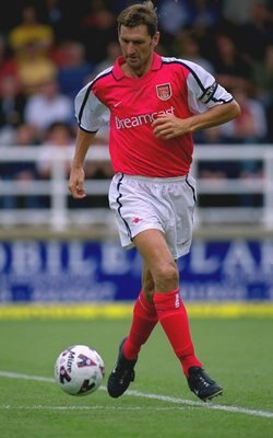 21 Jul 2001:  Tony Adams of Arsenal runs with the ball during the pre-season friendly match against Rushden & Diamonds played at Nene Park, in Irthlinborough, England. Arsenal won the match 2-0. \ Mandatory Credit: Shaun Botterill /Allsport