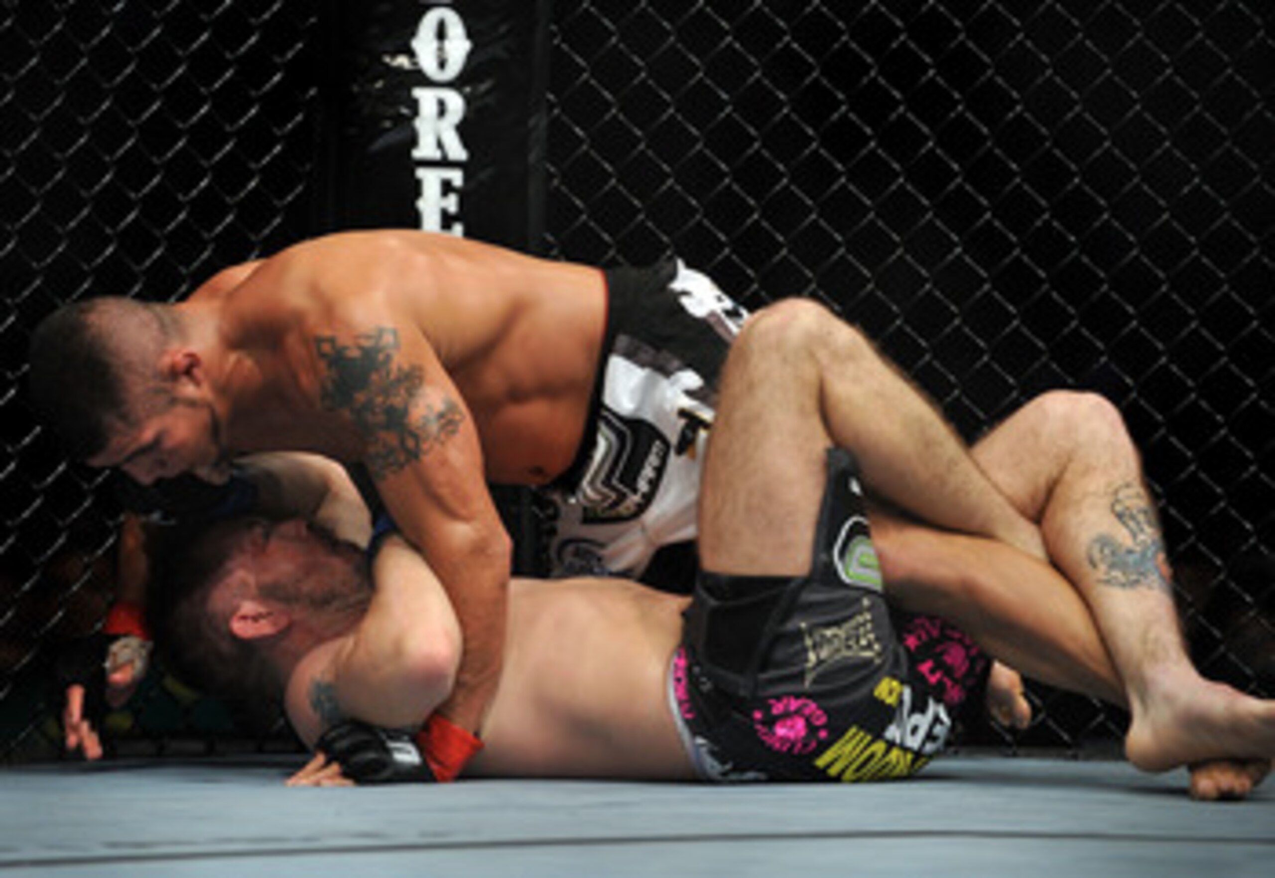 LOS ANGELES, CA - OCTOBER 24: UFC fighter Joe Stevenson (top) battles with UFC fighter Spencer Fisher (bottom) during their Lightweight bout at UFC 104: Machida vs. Shogun at Staples Center on October 24, 2009 in Los Angeles, California. (Photo by Jon K LOS ANGELES, CA - OCTOBER 24: UFC fighter Joe Stevenson (top) battles with UFC fighter Spencer Fisher (bottom) during their Lightweight bout at UFC 104: Machida vs. Shogun at Staples Center on October 24, 2009 in Los Angeles, California. (Photo by Jon K