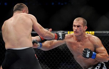 DALLAS - SEPTEMBER 19:  UFC fighter Junior Dos Santos (R) battles UFC fighter Mirko Cro Cop (L) during their Heavyweight bout at UFC 103: Franklin vs. Belfort at the American Airlines Center on September 19, 2009 in Dallas, Texas.  (Photo by Jon Kopaloff/