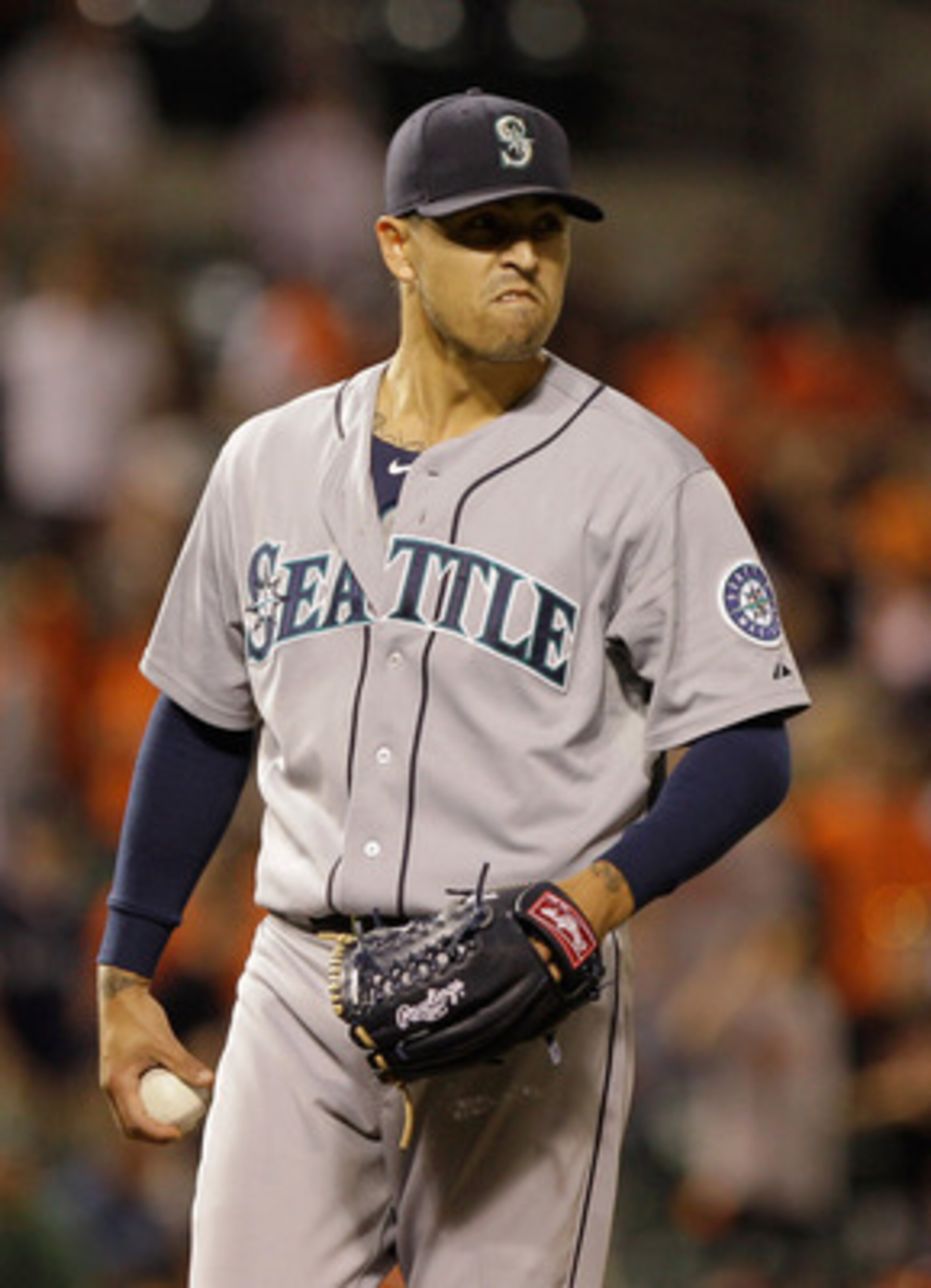 BALTIMORE, MD - MAY 12: Reliever Brandon League #43 of the Seattle Mariners reacts on the mound after hitting batter Vladimir Guerrero #27 of the Baltimore Orioles (not pictured) during the twelfth inning at Oriole Park at Camden Yards on May 12, 2011 in 